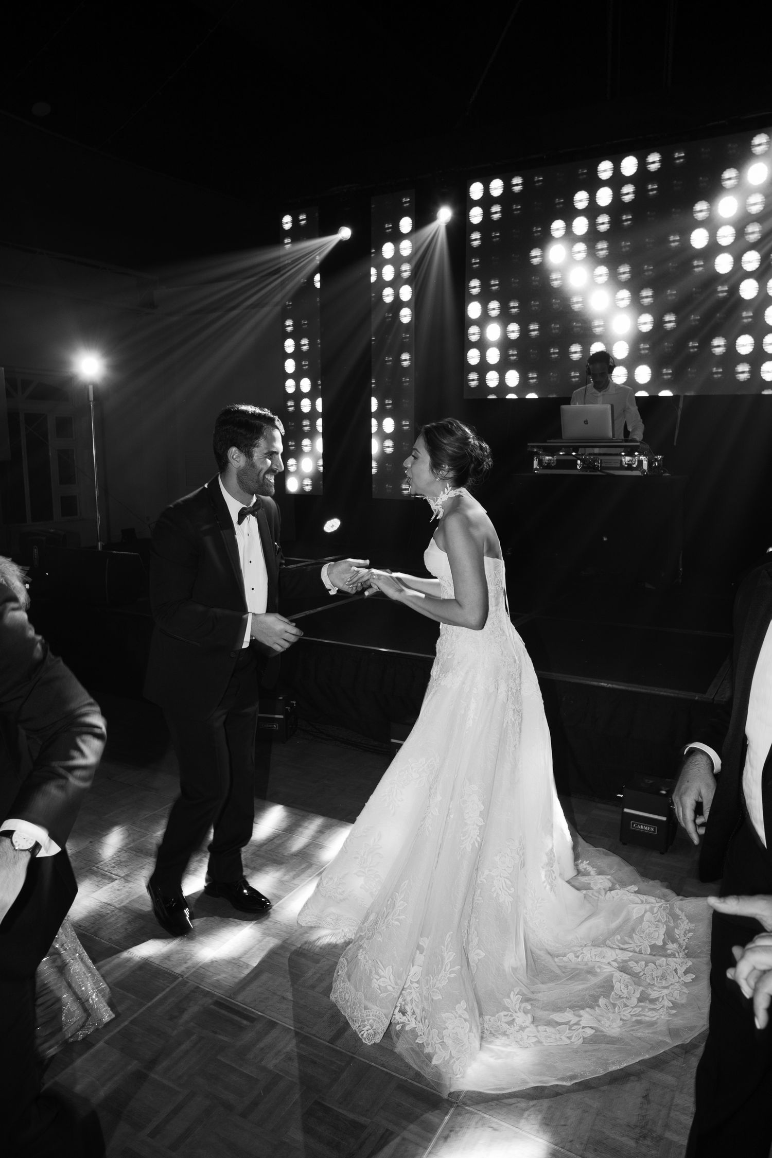 A romantic black and white wedding reception dance sequence showing the bride and groom in elegant formal attire.