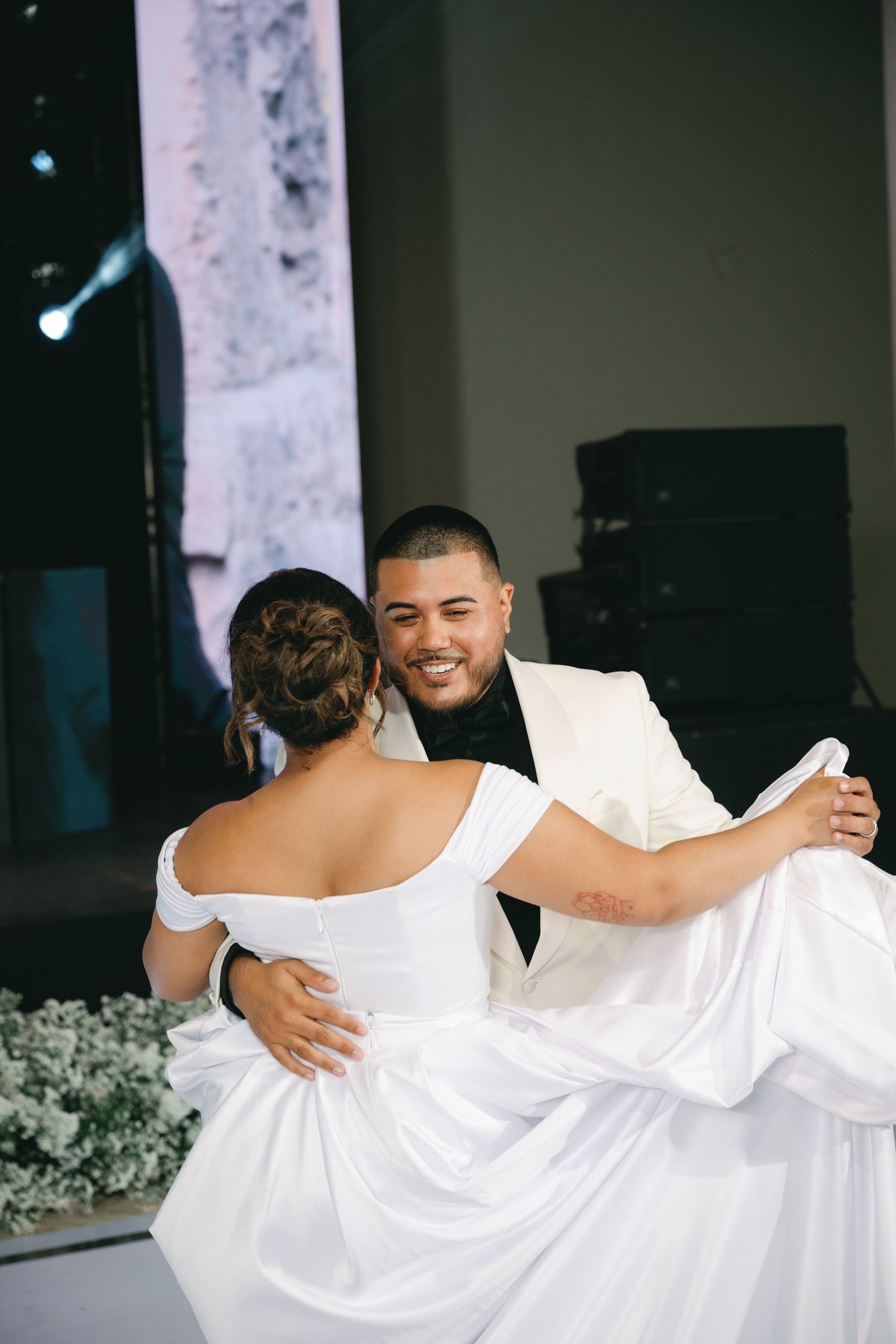 A romantic series of wedding photos showing a couple in white embracing and dancing together.