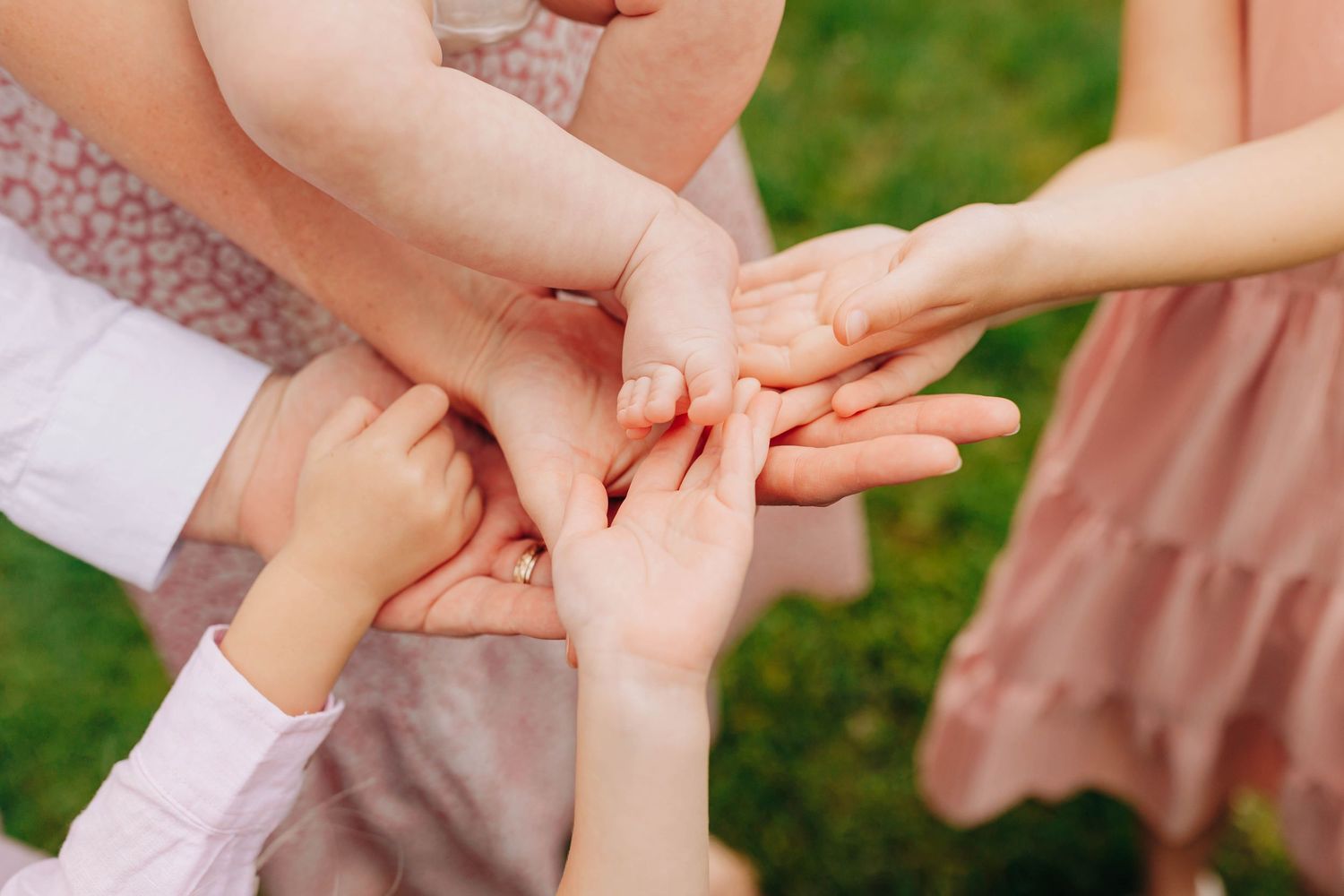 Close-up of hands touching in a gentle moment of connection.