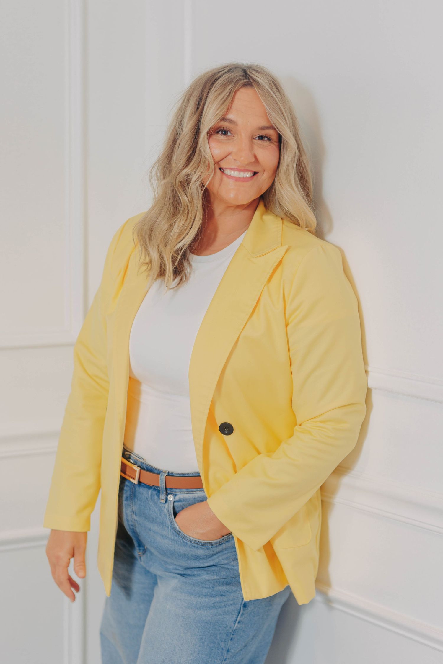 Fashion portrait series featuring yellow blazer and denim styled against white background.