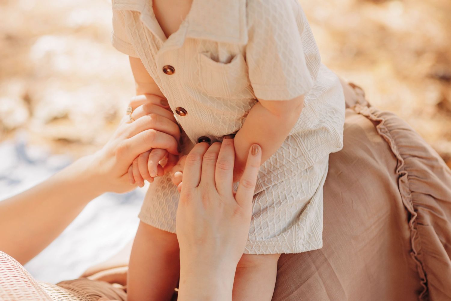 Soft, dreamy portrait session in warm autumn lighting with neutral tones.