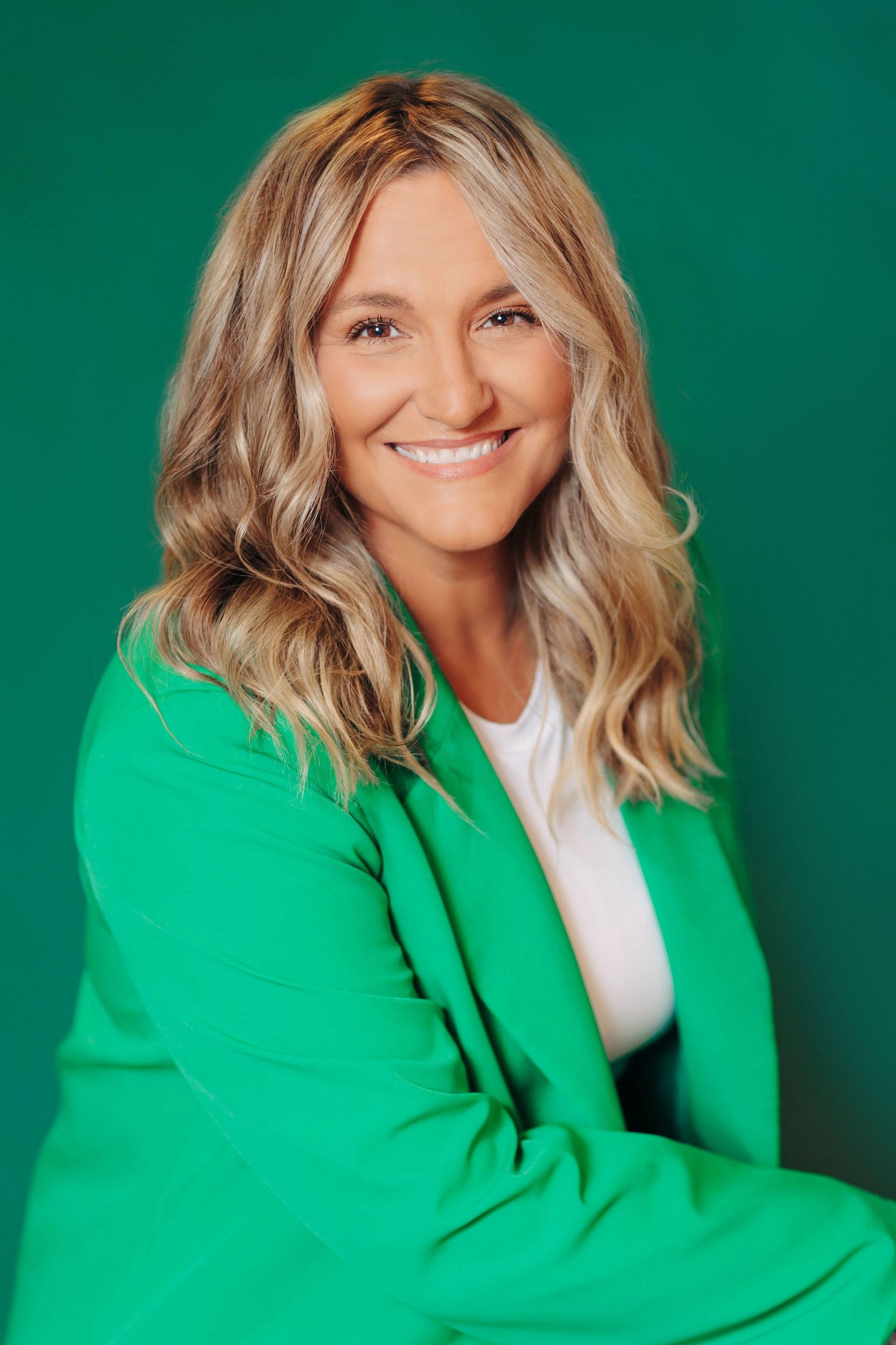 Portrait series against green background showing vibrant fashion and dynamic poses.