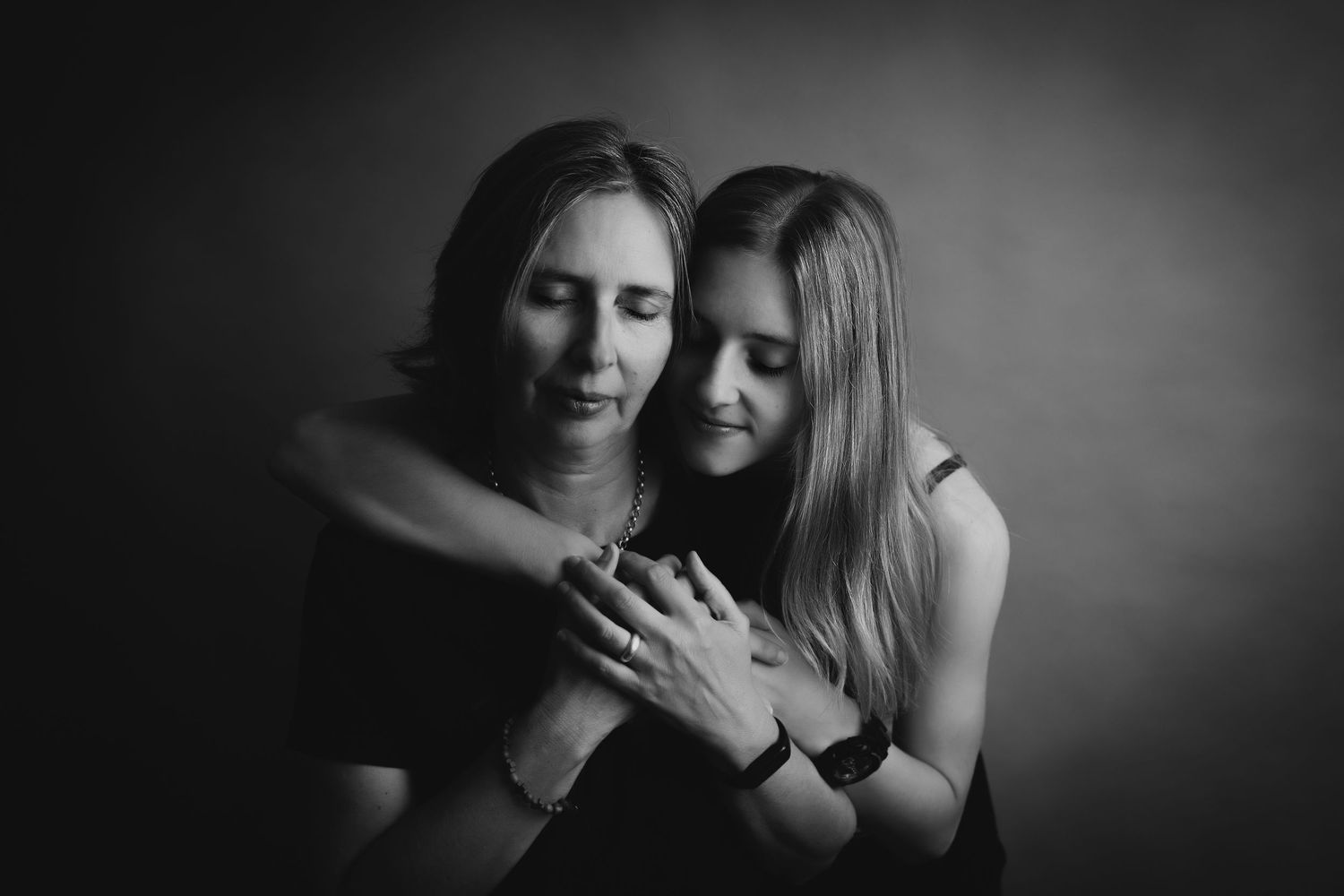 A series of black and white romantic couple photos showing intimate moments and embraces.