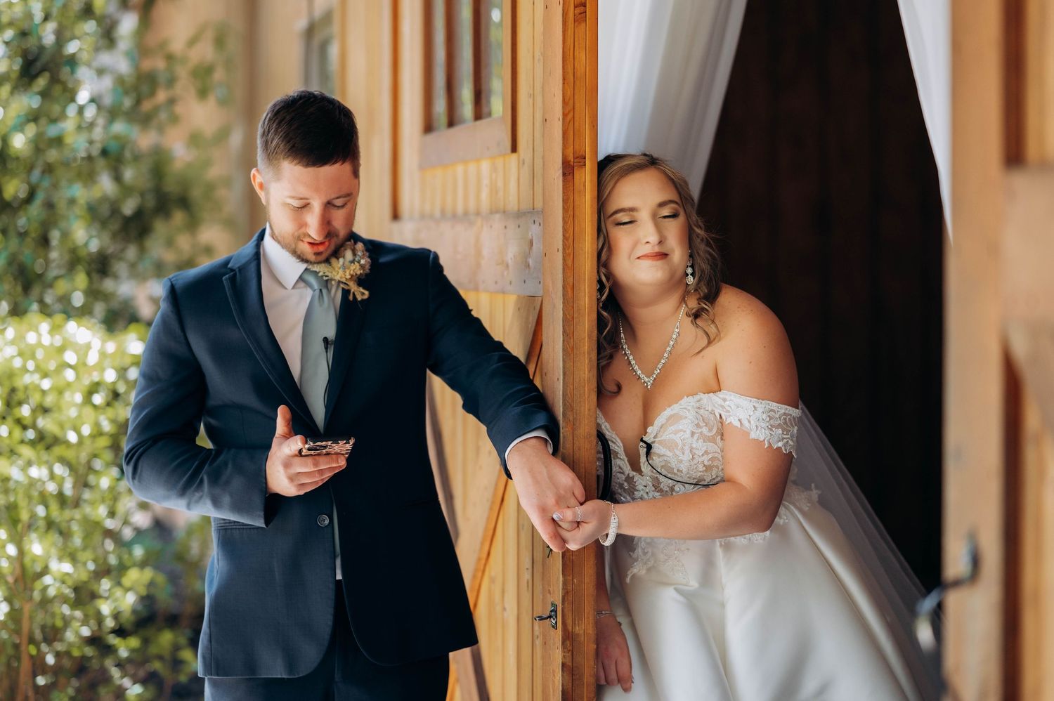 Wedding ceremony moments captured through doorway with elegant decor and lighting.