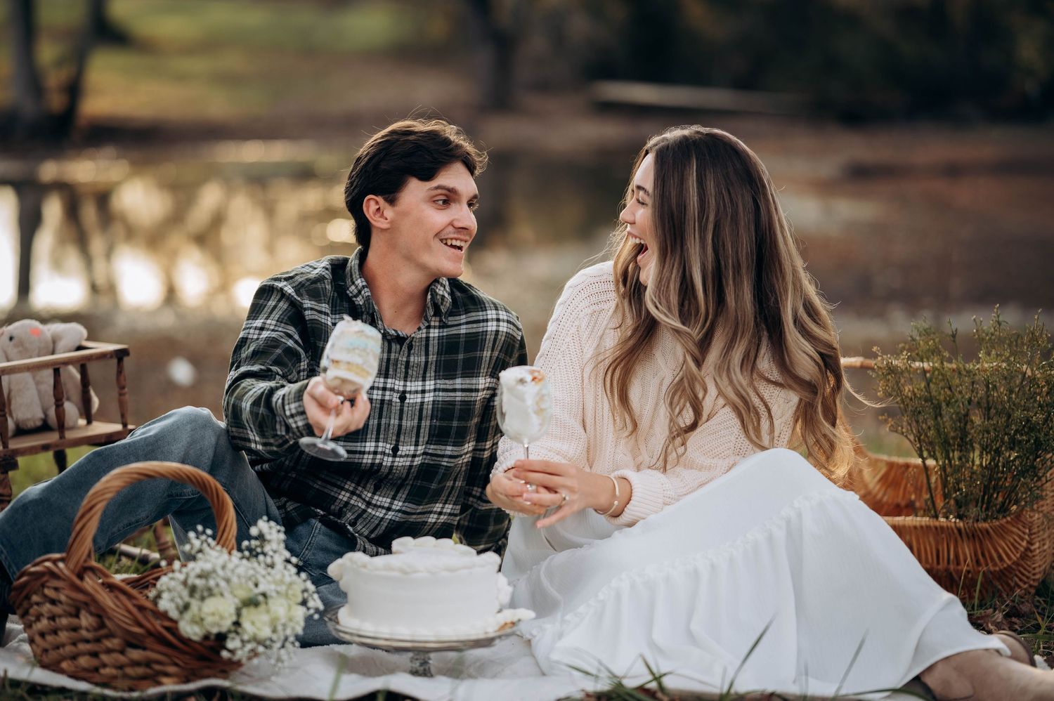 Couple in casual attire shares intimate moment during outdoor photoshoot.