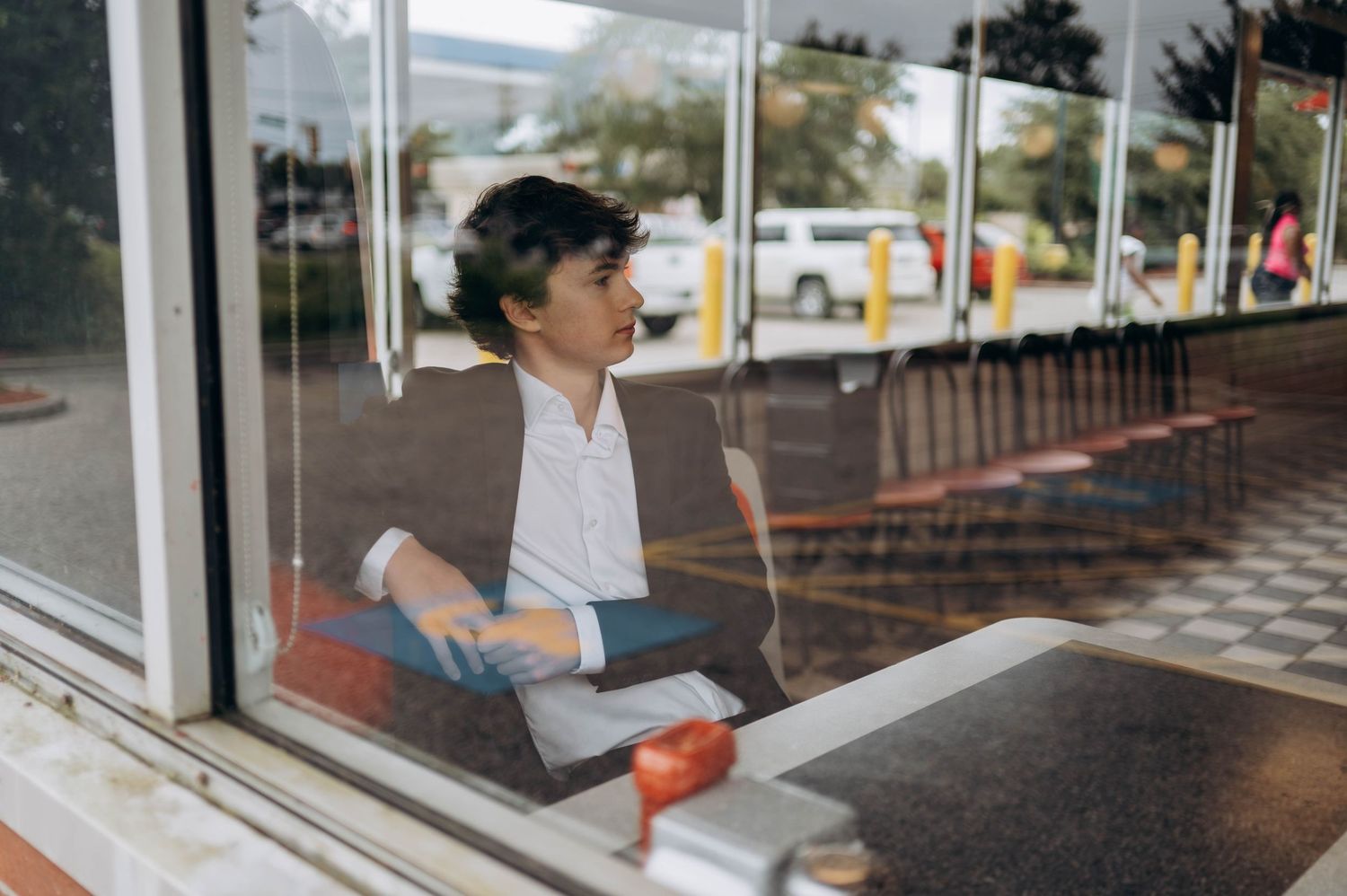 View through glass windows of a Waffle House restaurant exterior.