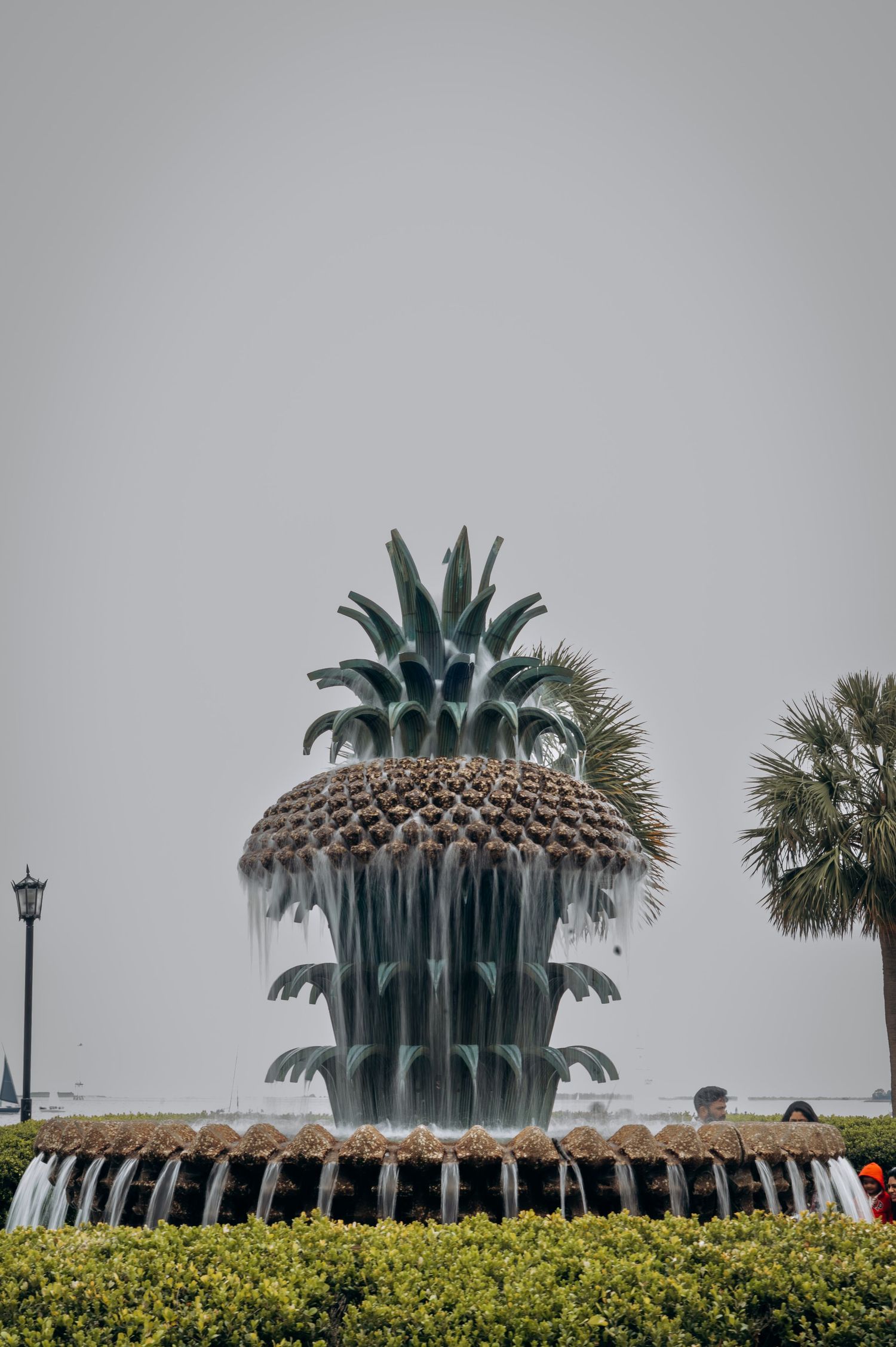Iconic Pineapple Fountain at Waterfront Park in Charleston, South Carolina on an overcast day.