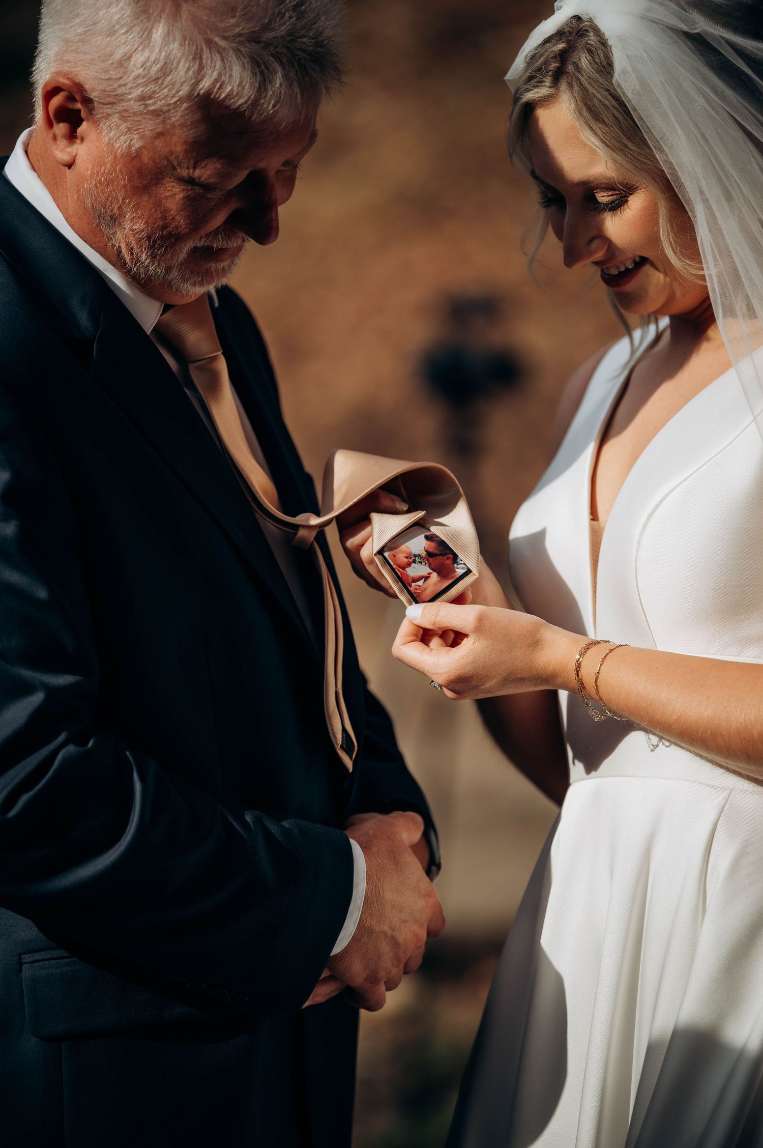 Close-up shots of a couple exchanging rings during an intimate wedding ceremony.