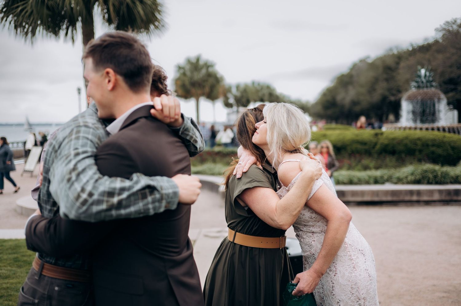 A series of romantic couples dancing together outdoors in a park setting at sunset.