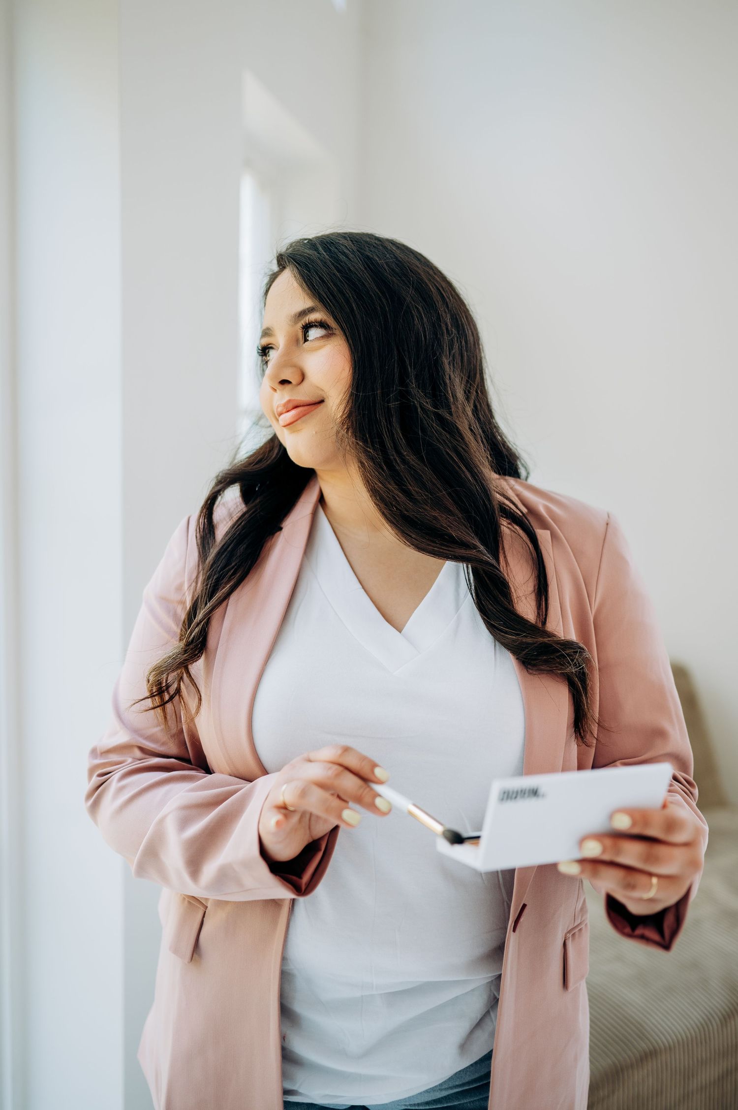 Professional lifestyle photo showing business casual style while holding tablet device.
