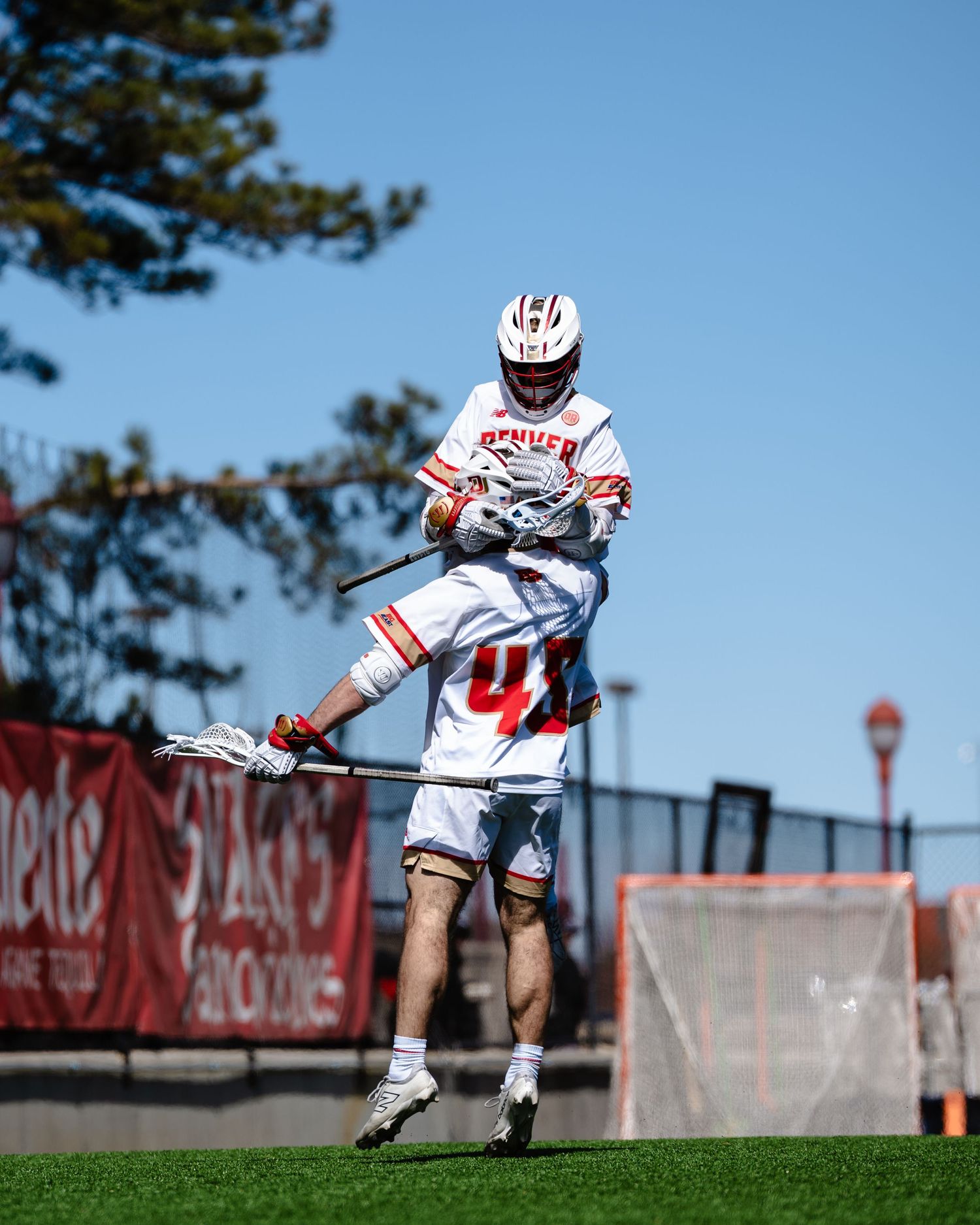 Lacrosse players celebrate.