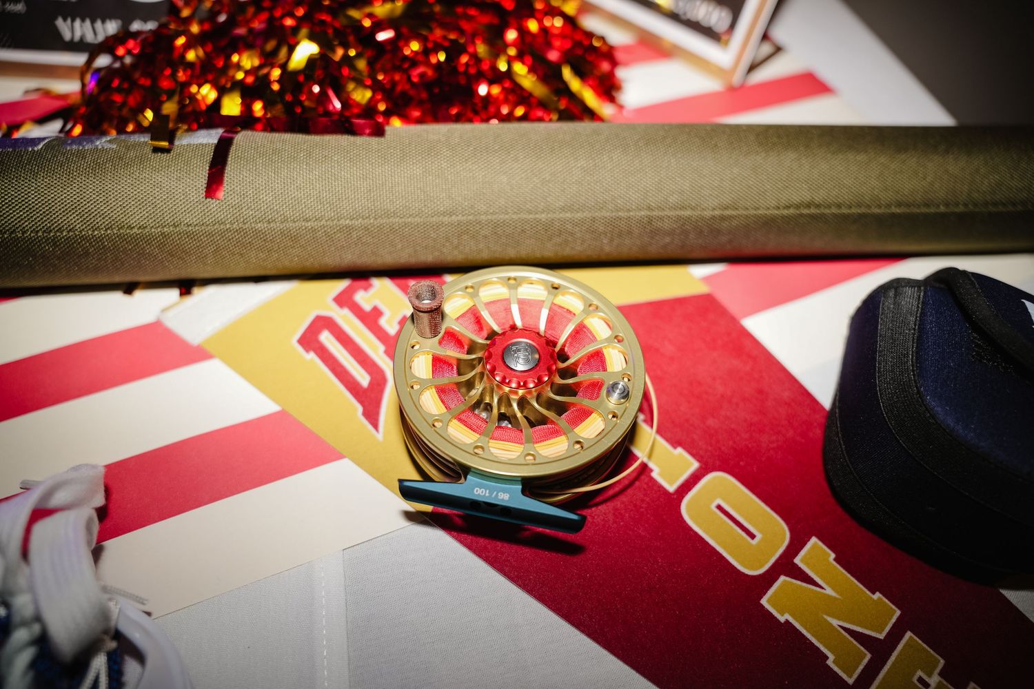 Close-up of red and gold decorative elements on a table setting.
