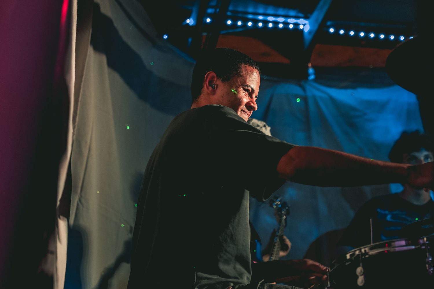 Drummer performing on stage.