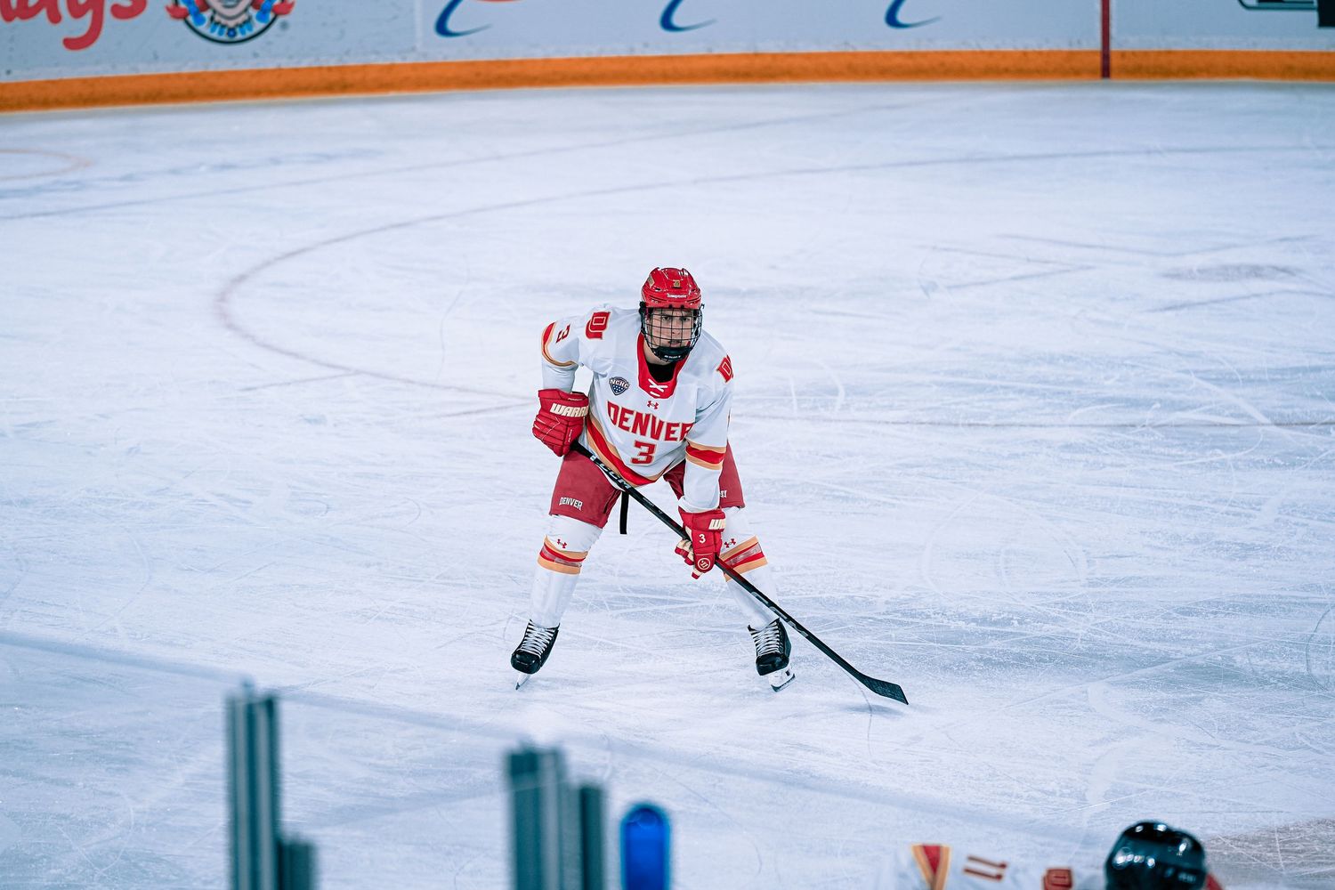Hockey player in red and white uniform.