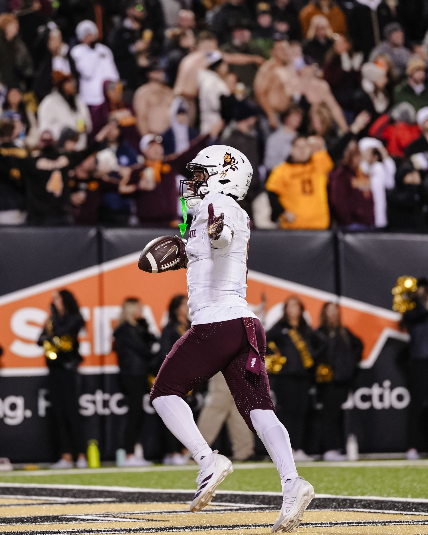 Football player celebrates.