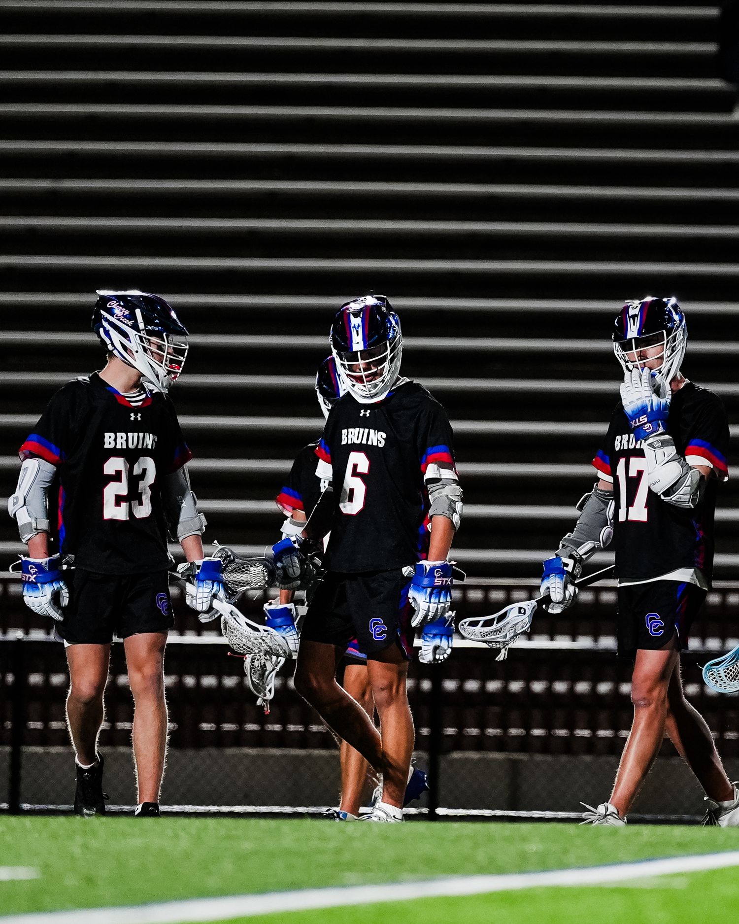 Row of lacrosse players lined up.