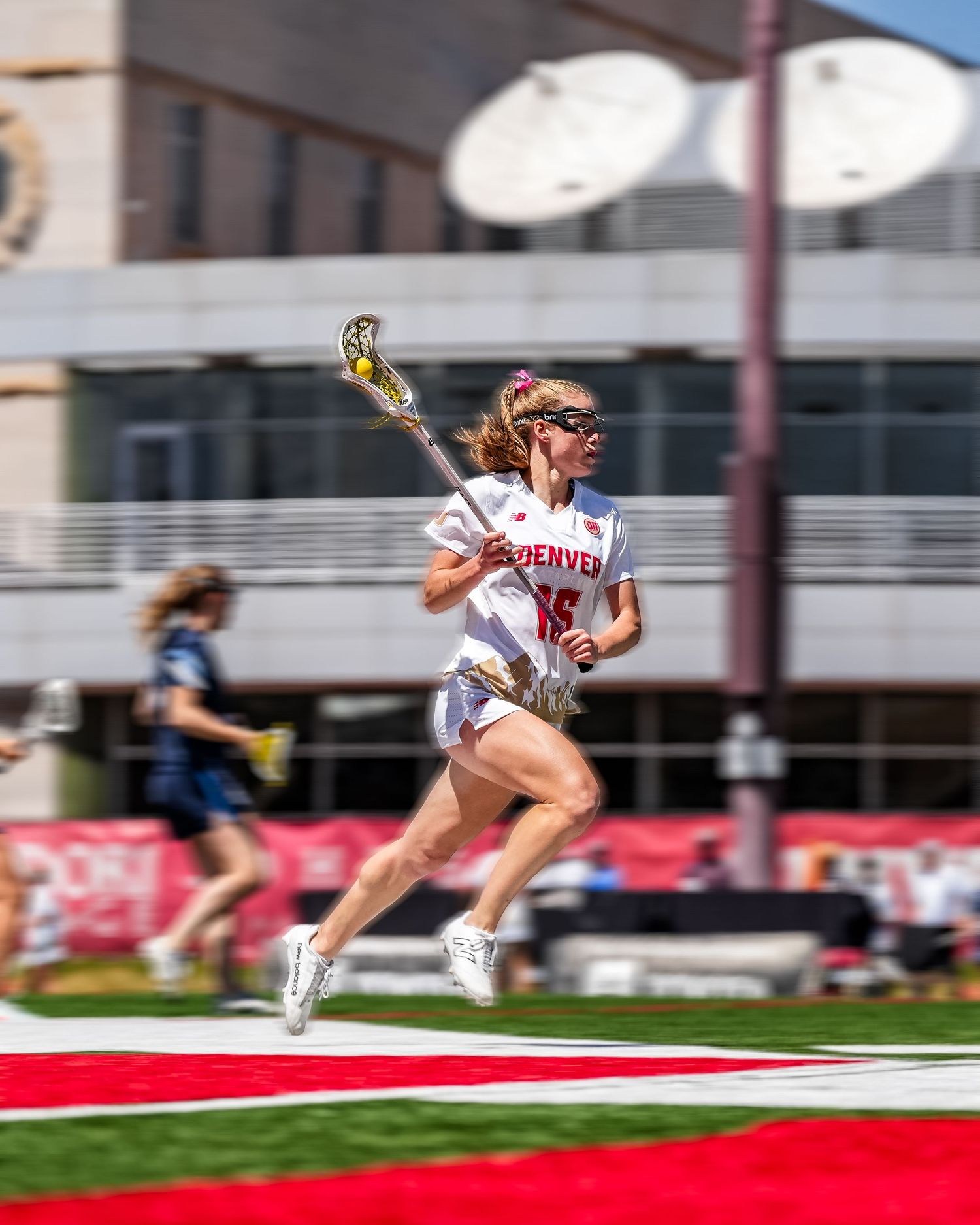 Lacrosse player running.
