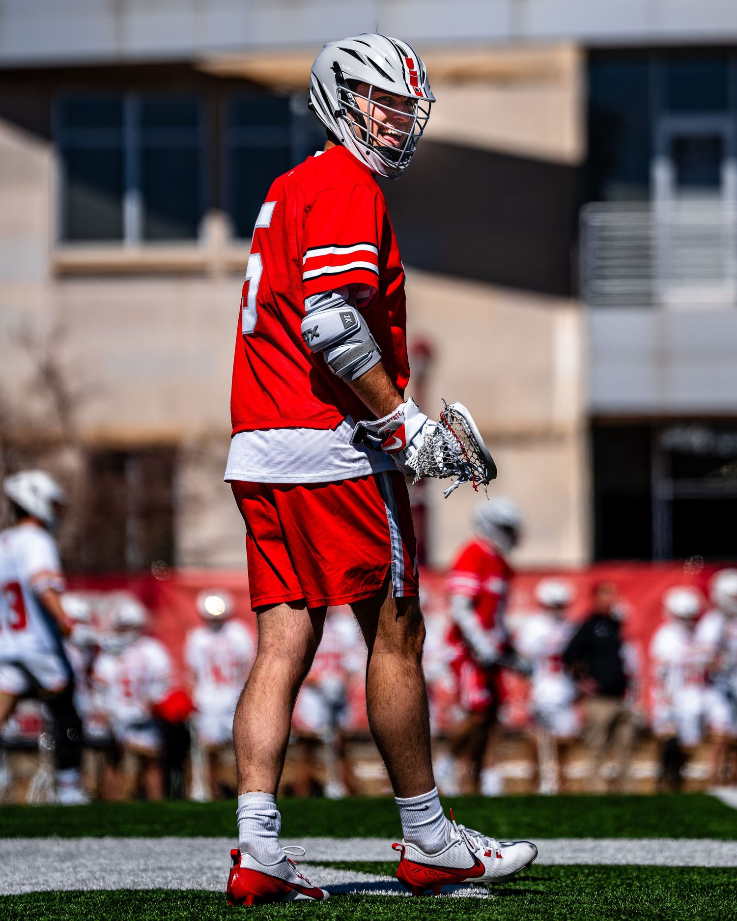 Ohio State lacrosse player smiles at the camera.
