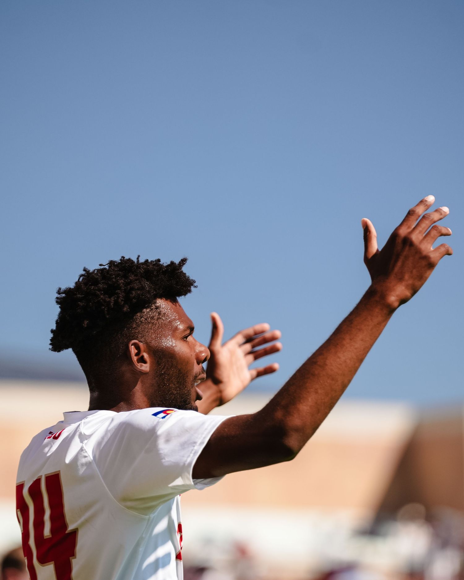Soccer player in white jersey.