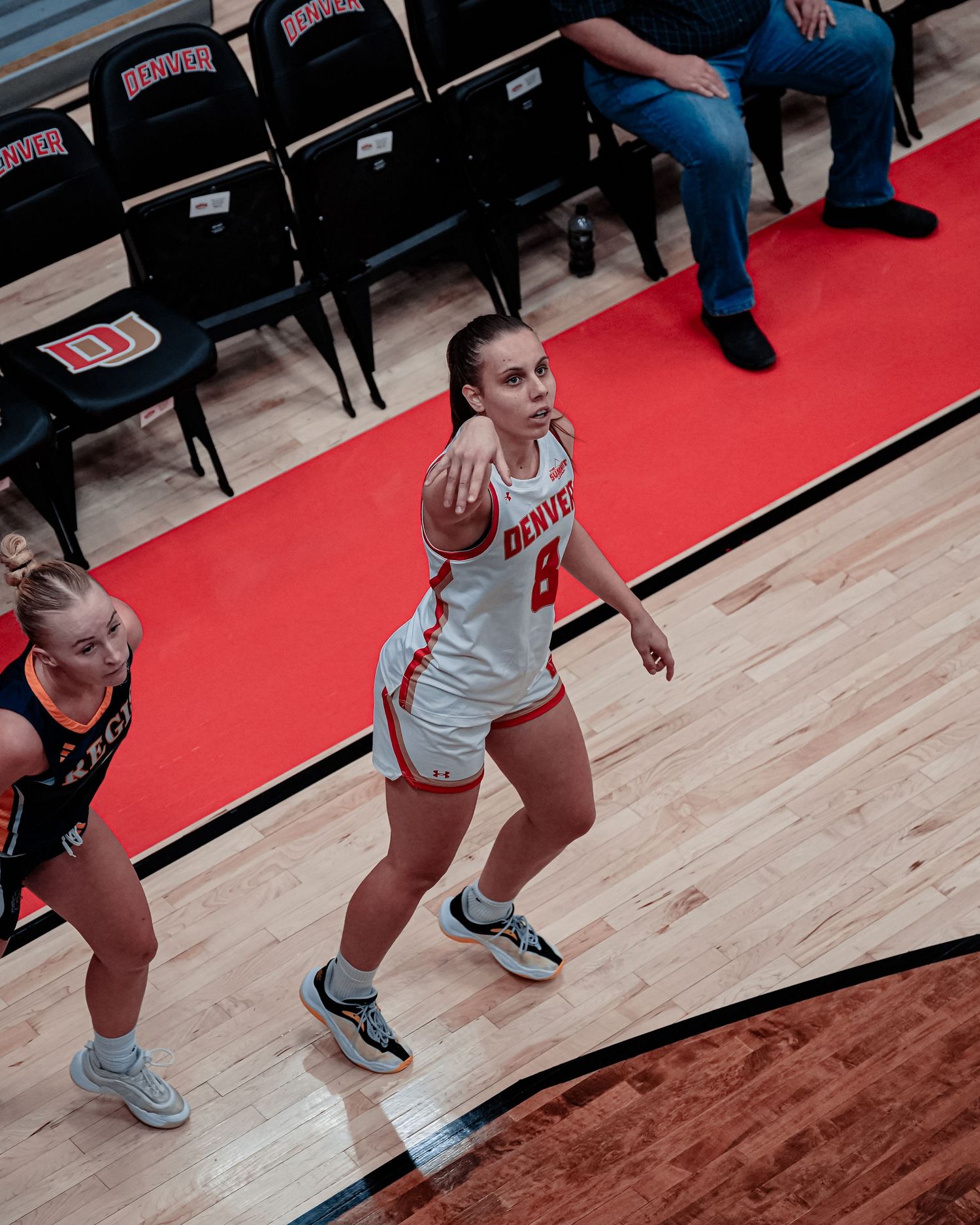 Basketball player in white uniform.