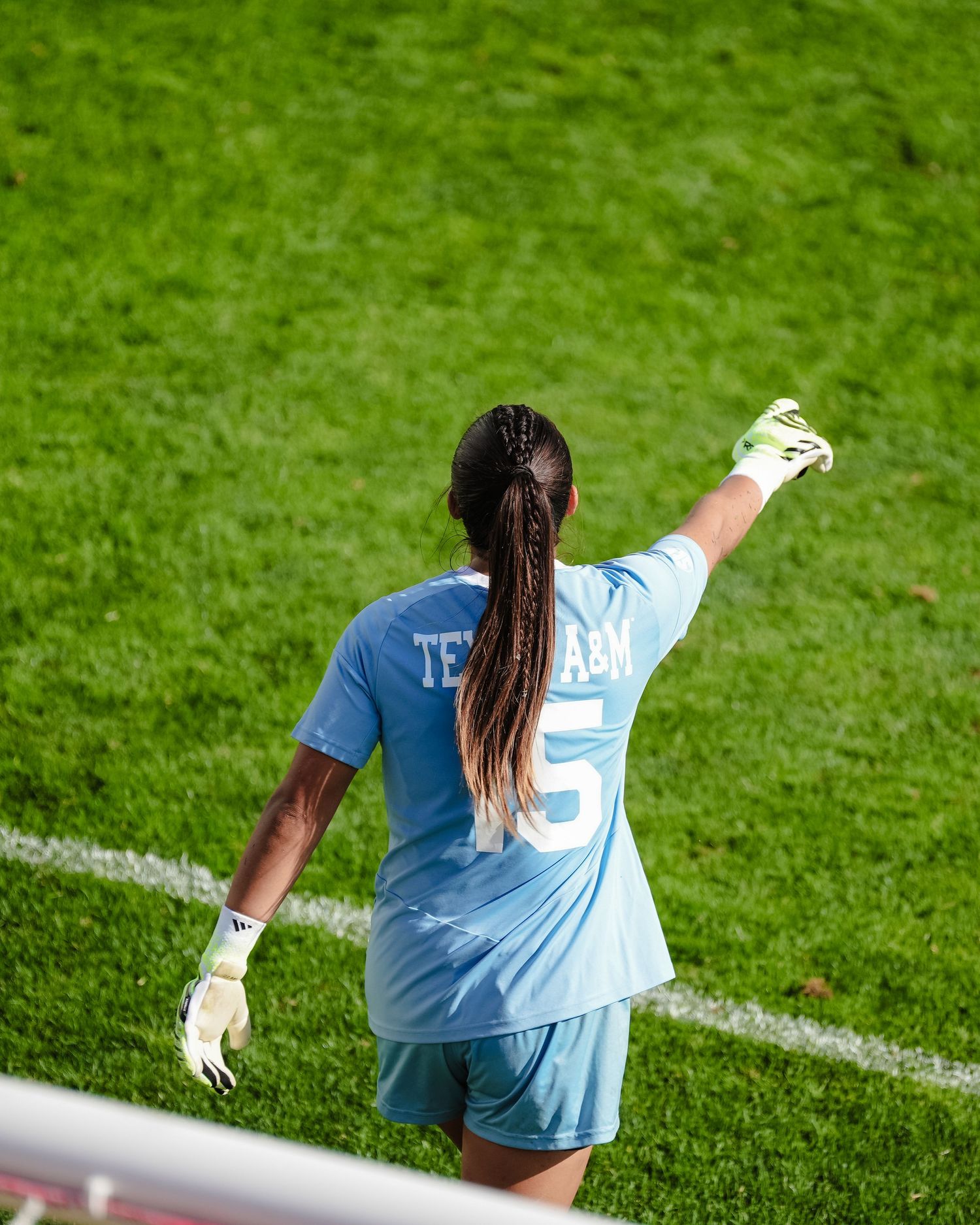 Soccer player in light blue jersey.