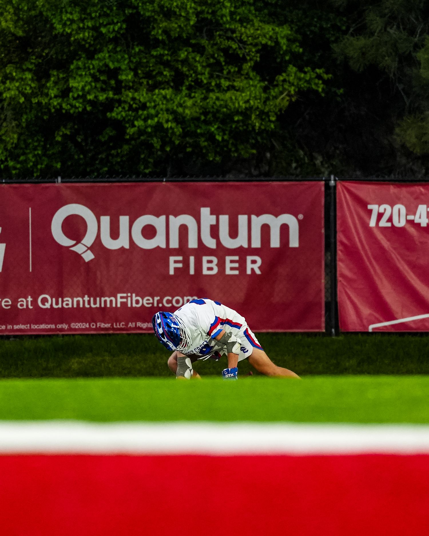 Lacrosse player practicing faceoffs.