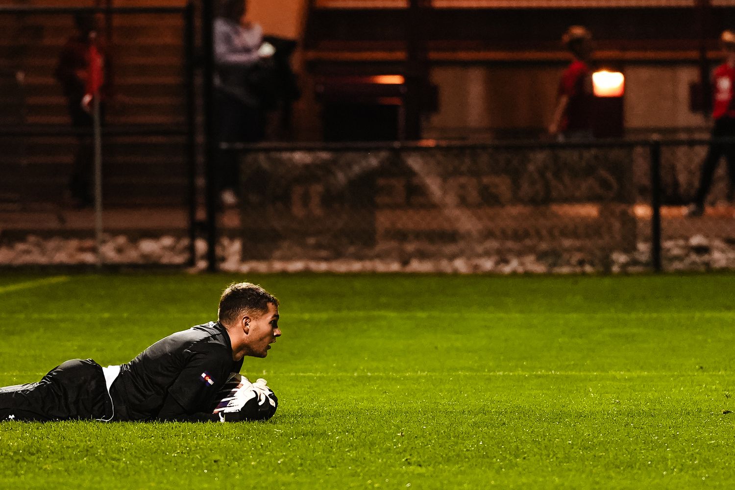 Denver goal keeper grabs a ball.