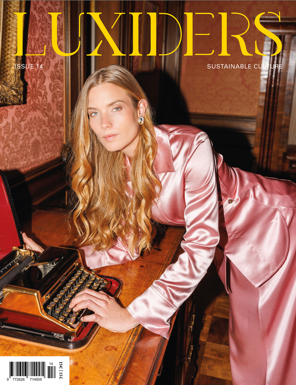 Luxiders Issue 14 sustainable culture magazine cover featuring a model in pink satin suit at a vintage typewriter.