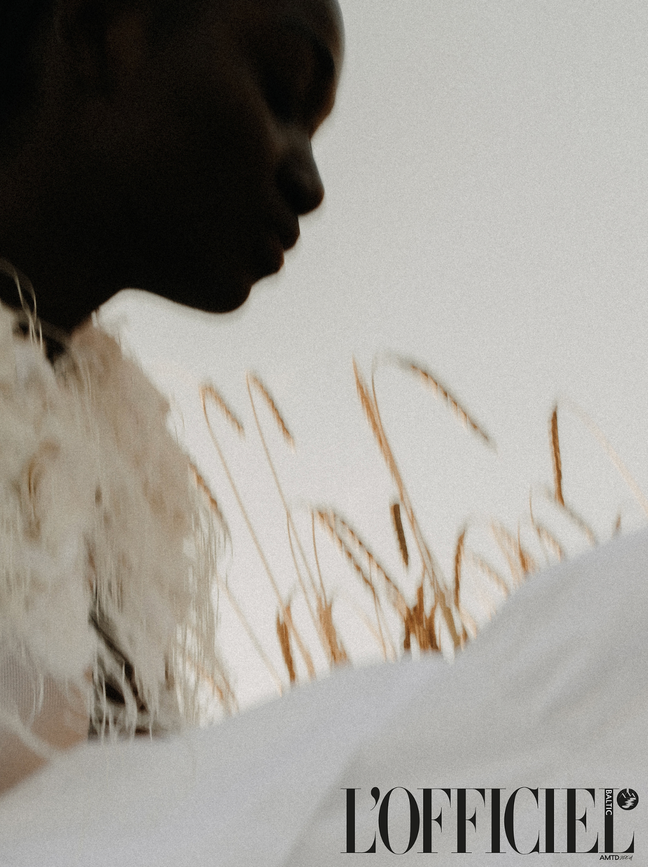 Silhouette profile of model with dried wheat grasses, L'Officiel fashion editorial.