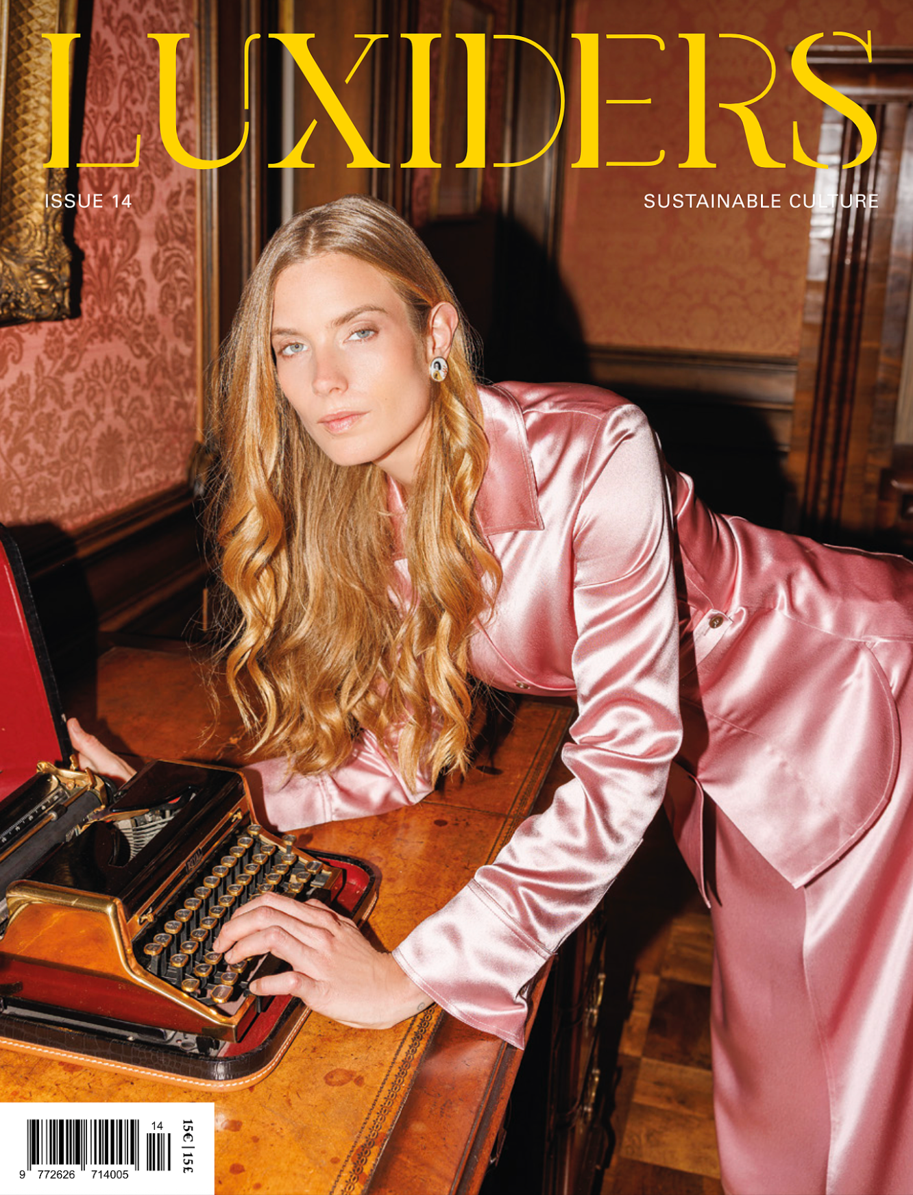 Blonde model in pink satin suit at vintage typewriter, Luxiders sustainable culture magazine cover.