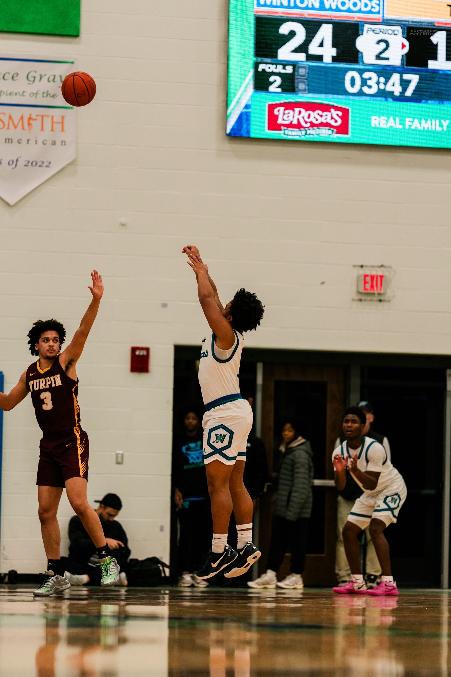 Winton Woods leads Turpin 24-1 with 3:47 remaining as player attempts shot in high school basketball game.