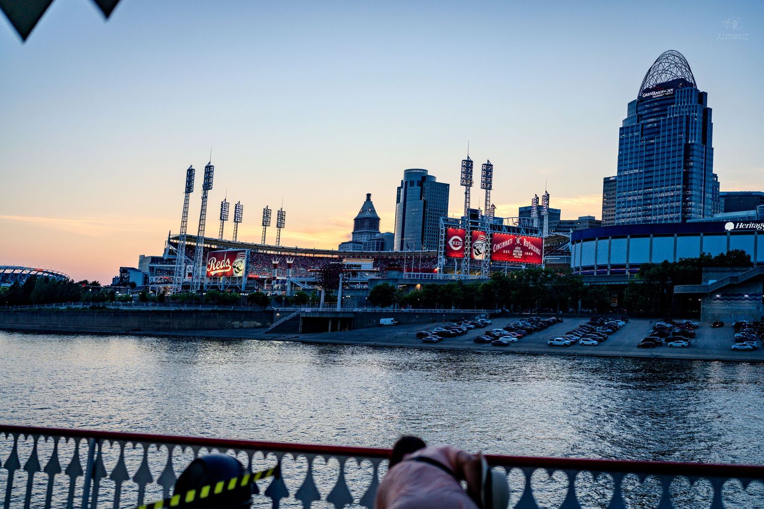 Cincinnati skyline with Great American Ball Park at sunset reflected in the Ohio River.