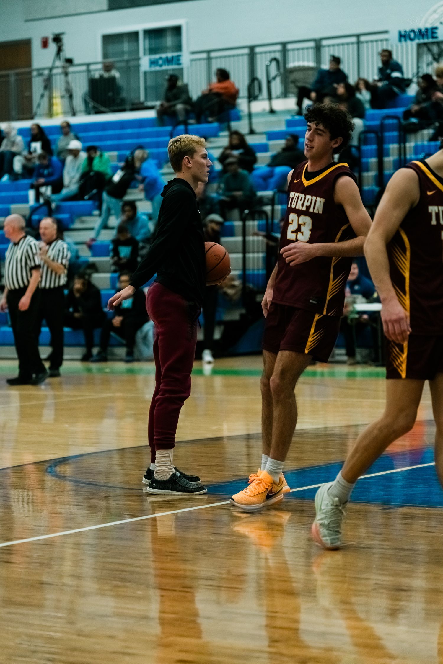 Turpin high school basketball player number 23 during pregame warmups on court.