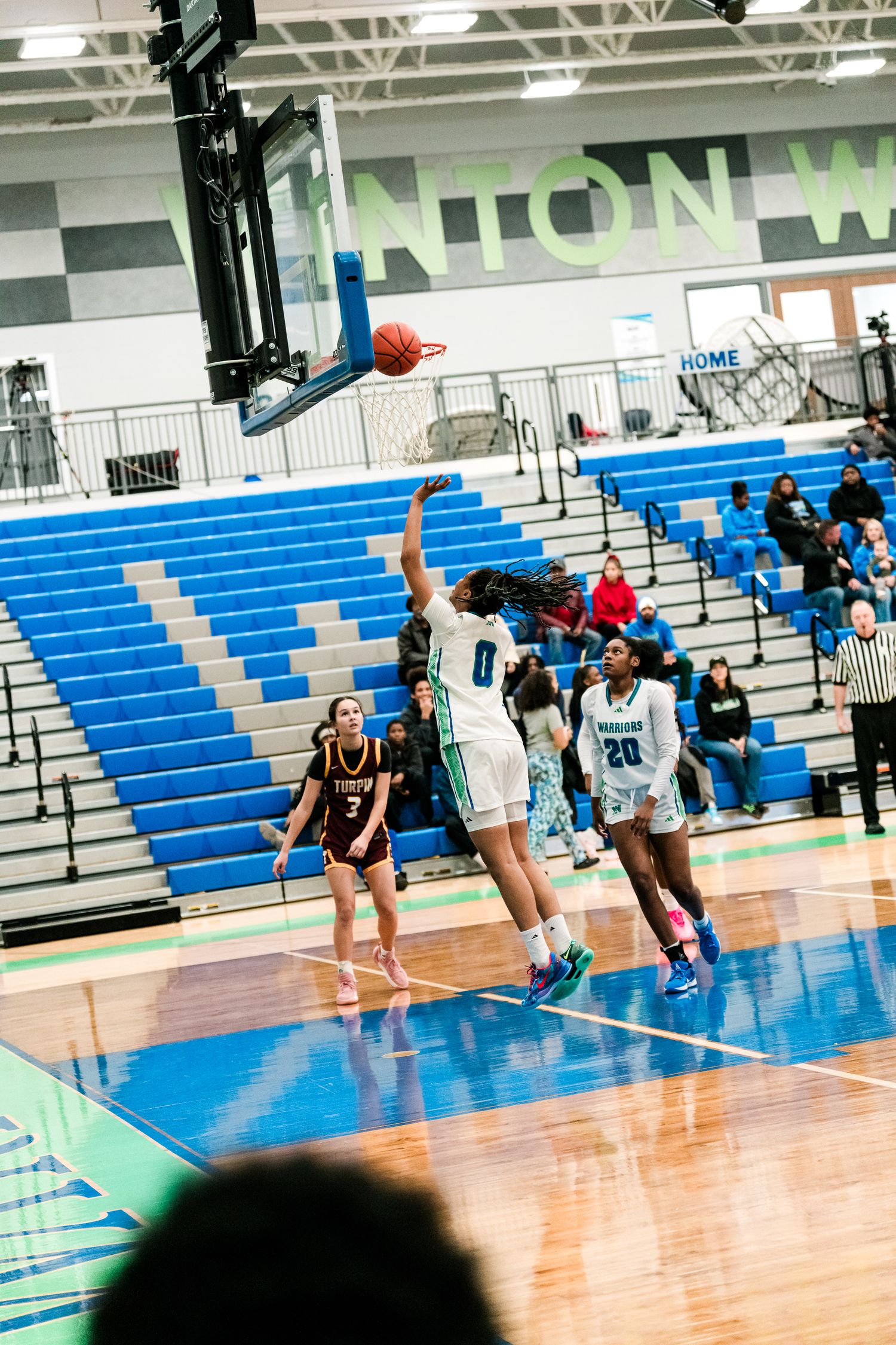 Winton Woods girls basketball player #0 attempts a jump shot during a home game against Turpin.