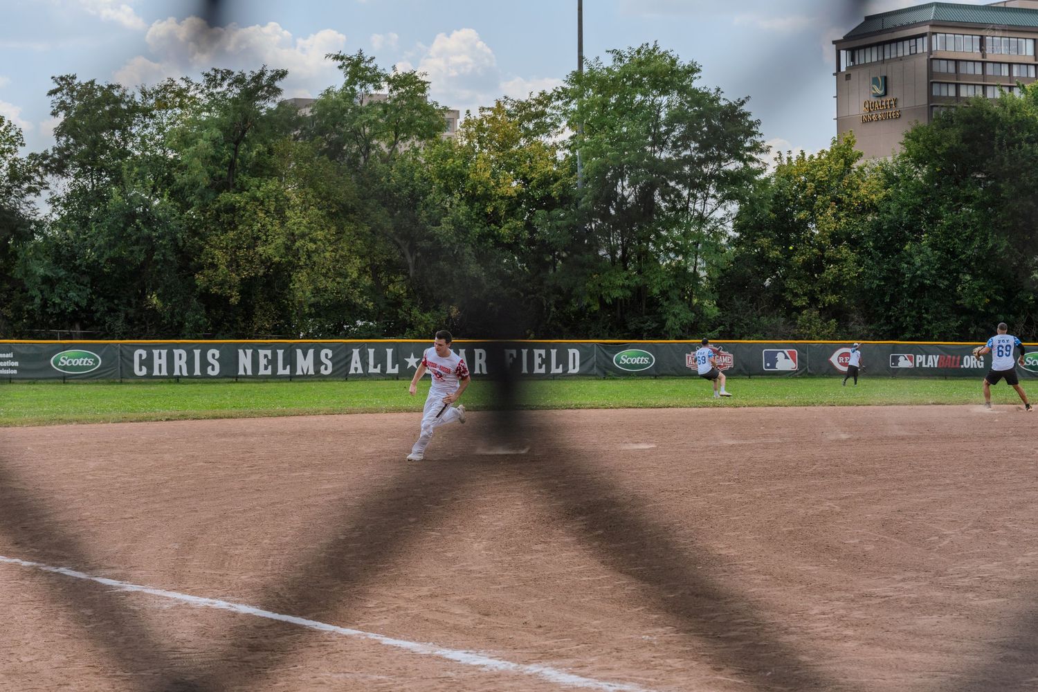 Wide-angle view of Chris Helms All-Star Field during an outdoor charity softball game.