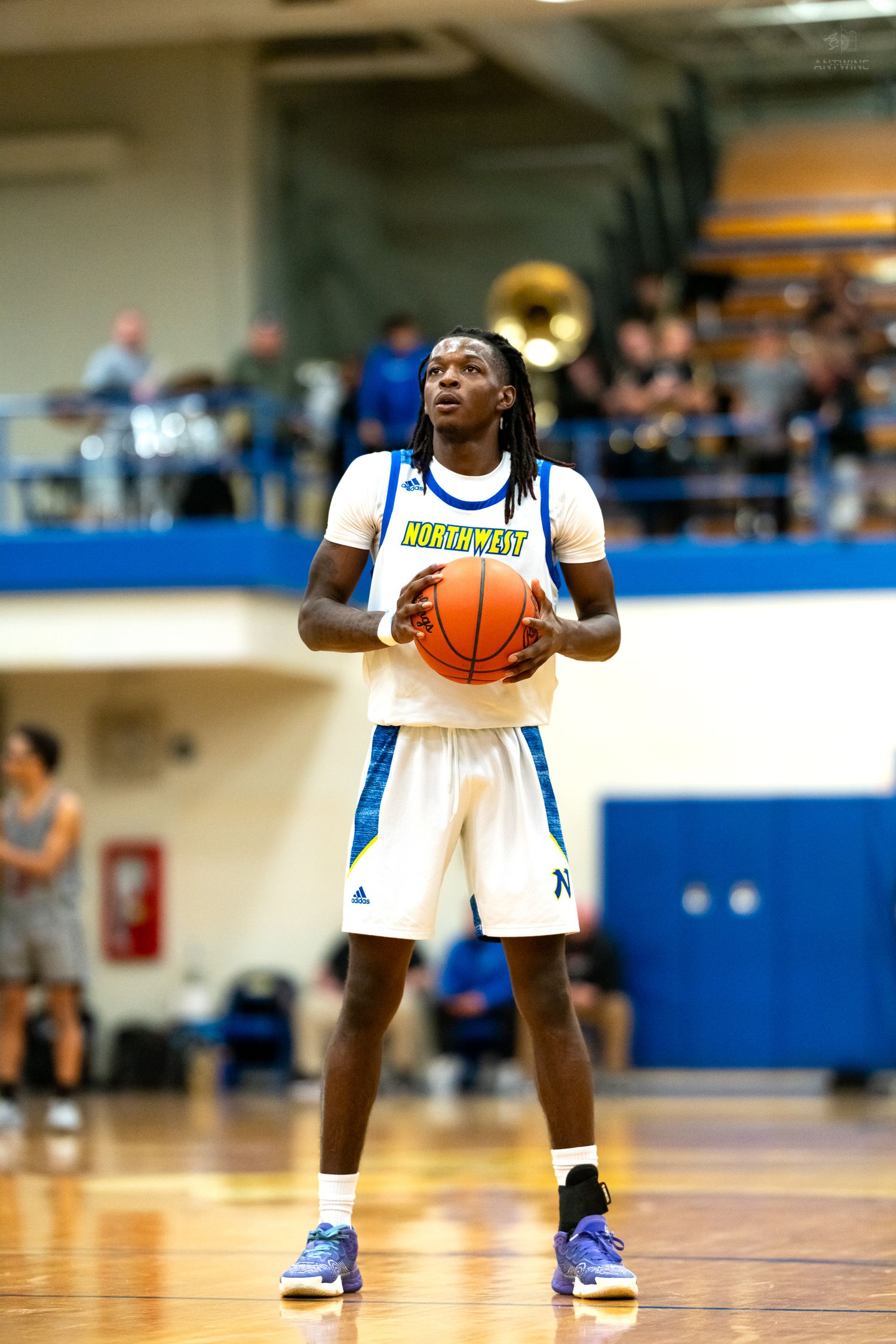 Northwest basketball player #3 focuses at the free throw line during a high school game.