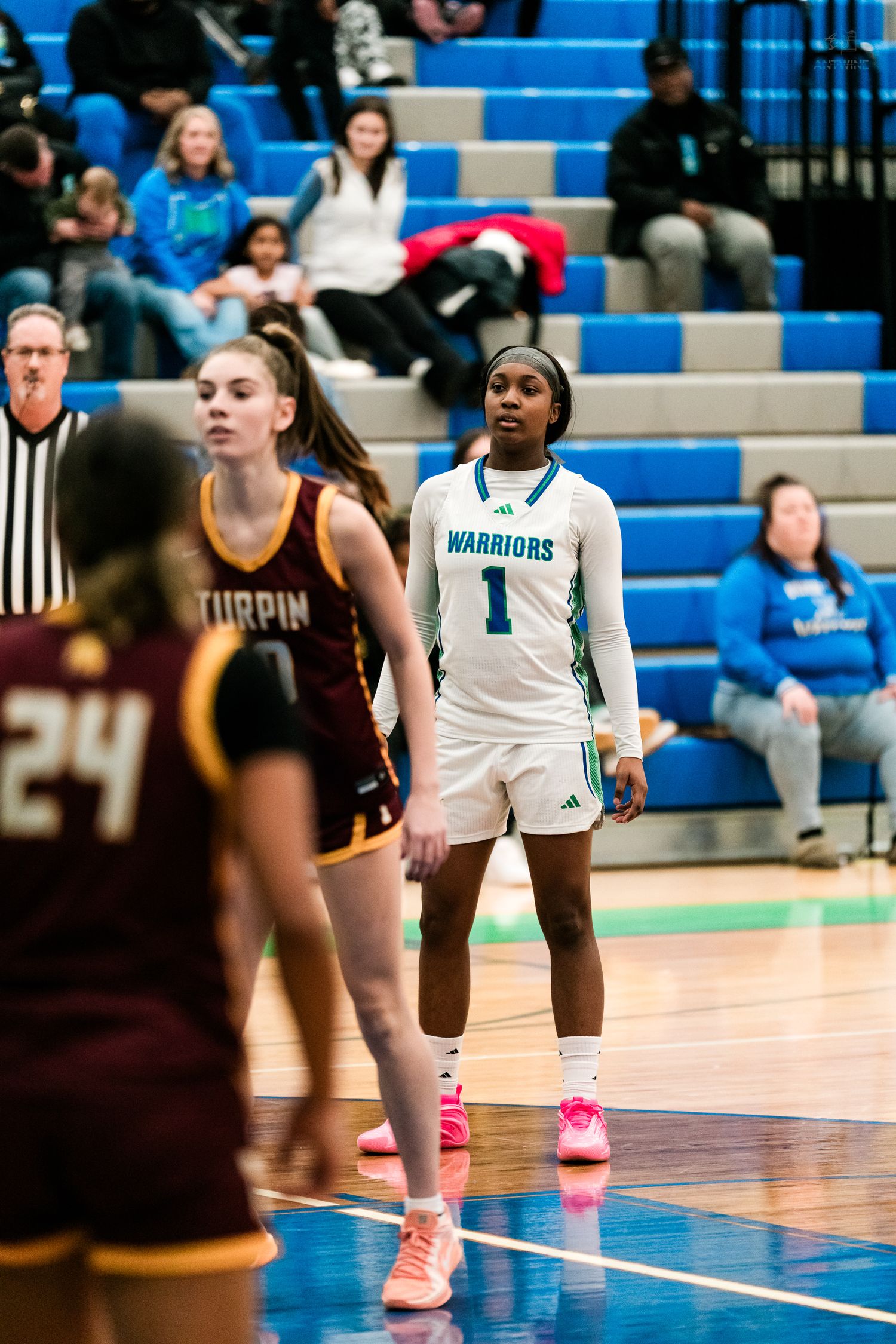 Warriors number 1 stands at the free throw line in a girls high school basketball game against Turpin.