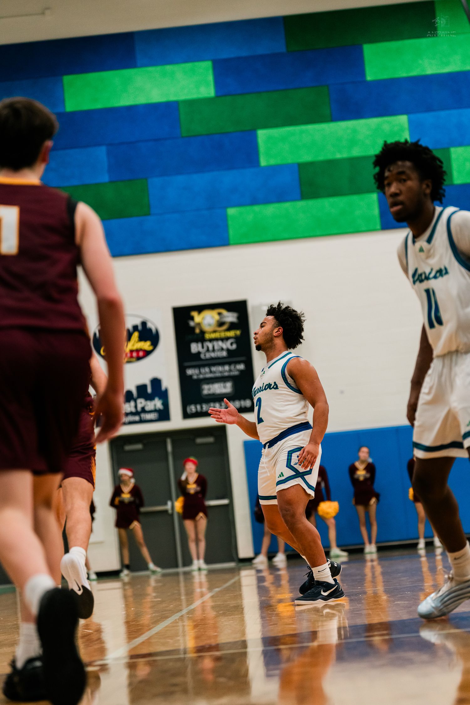 Winton Woods Warriors player sets up the offense against Turpin High School during a basketball game.