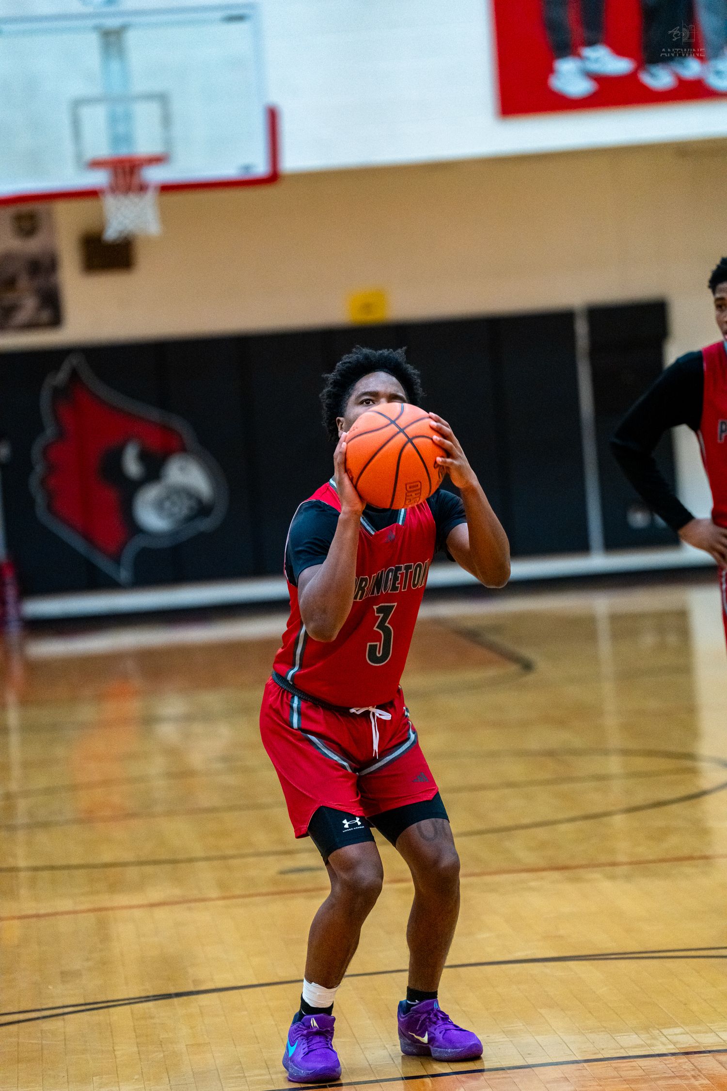 Princeton #3 player shoots free throw during high school basketball game in Colerain gym.