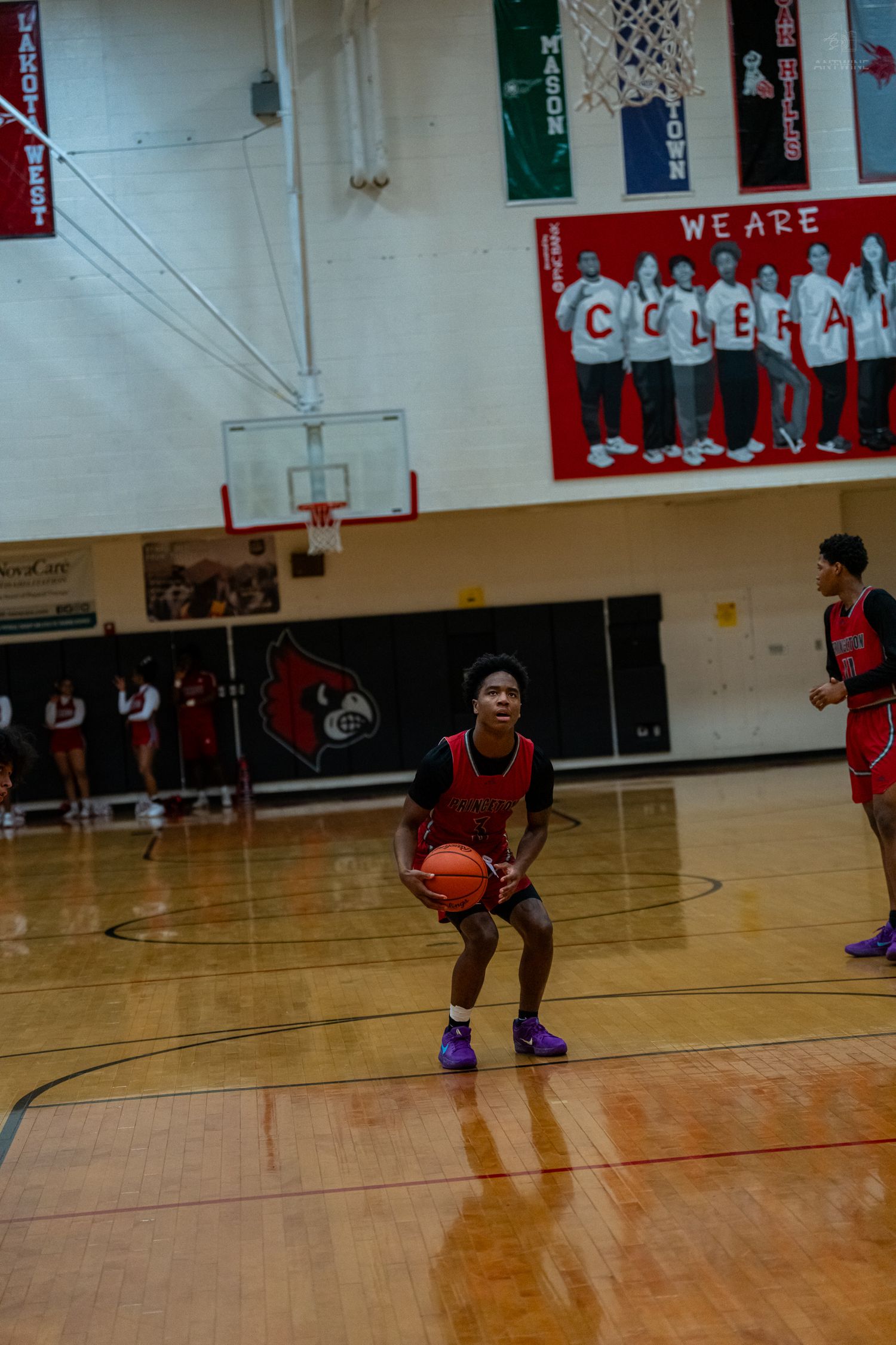 Princeton basketball player prepares to shoot free throw in Colerain High School gymnasium.