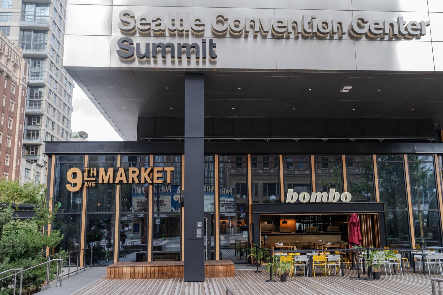 Seattle Convention Center Summit building exterior with 9th Market and Bombo restaurant storefronts.