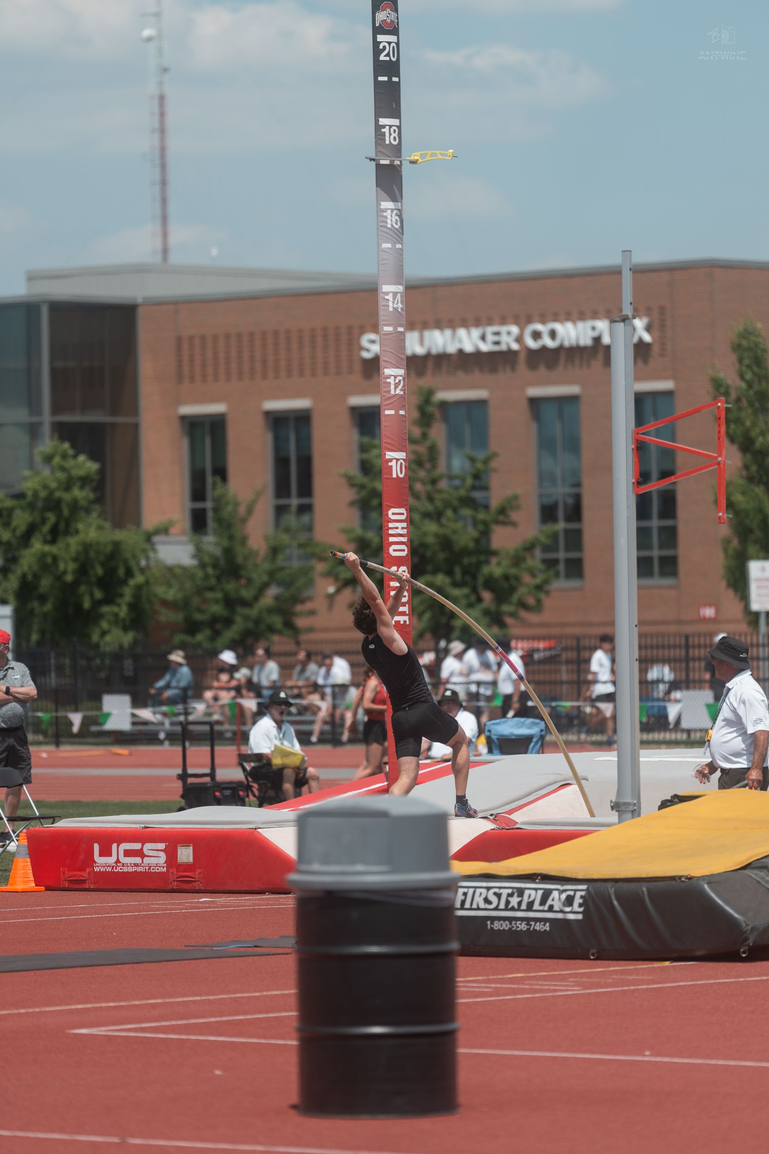Athlete plants the pole during a pole vault attempt at Ohio State University Scarlet and Gray track meet.
