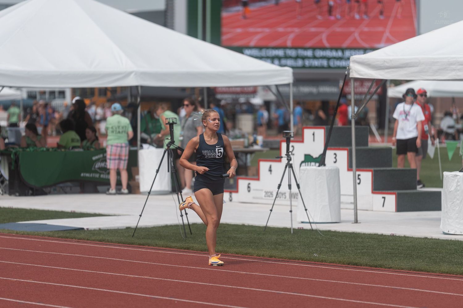 Female track athlete prepares in her lane at the OHSAA State Track and Field Championship meet.
