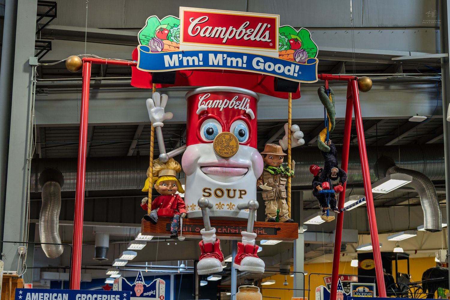 Campbell's Soup mascot display with M'm! M'm! Good! sign at Jungle Jim's International Market.