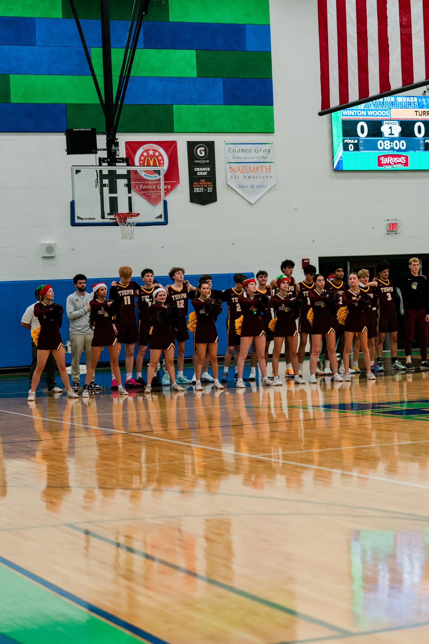 Turpin high school basketball team lined up on court for pregame introductions.