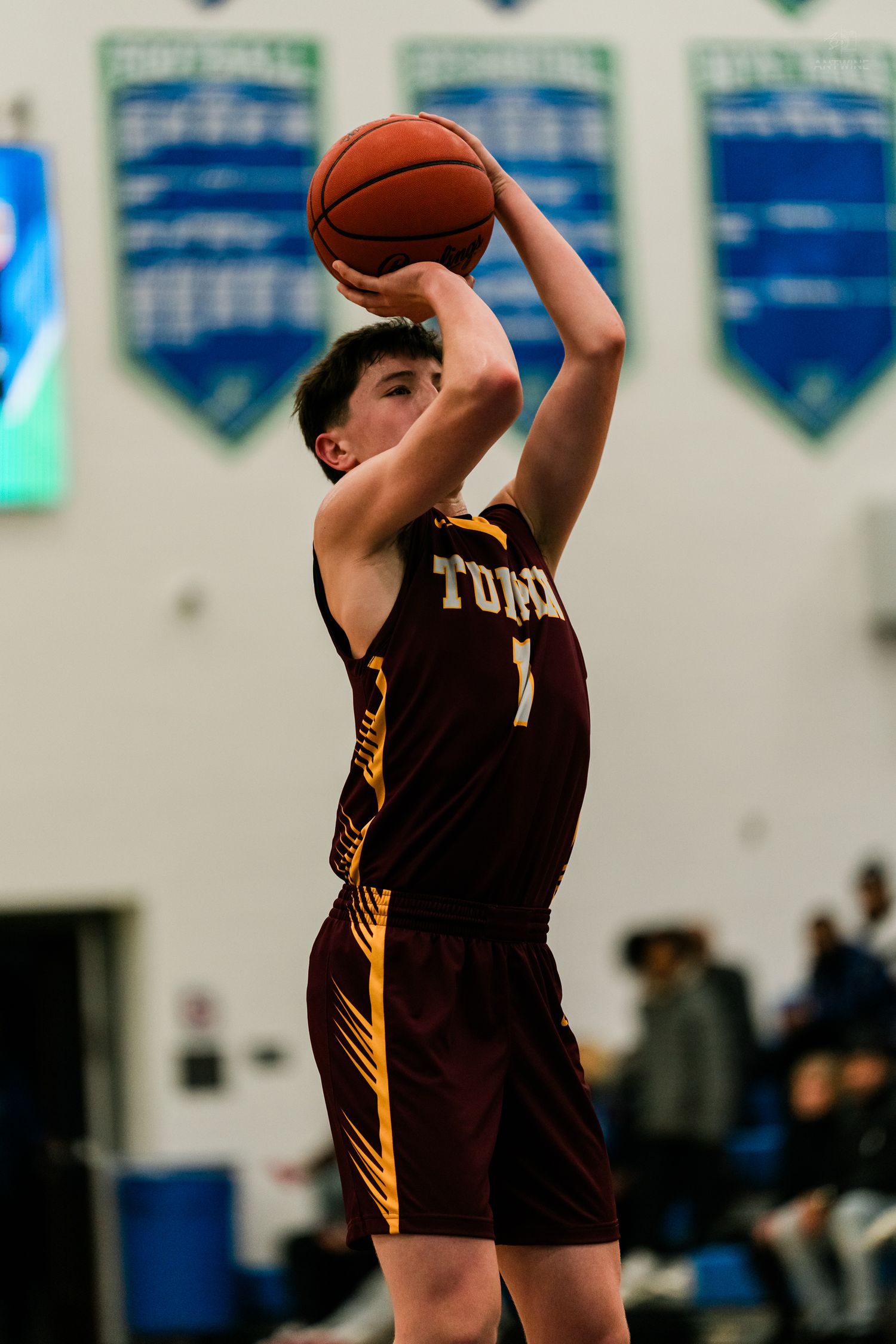 Turpin High School player number 1 shoots a jump shot during a high school basketball game.