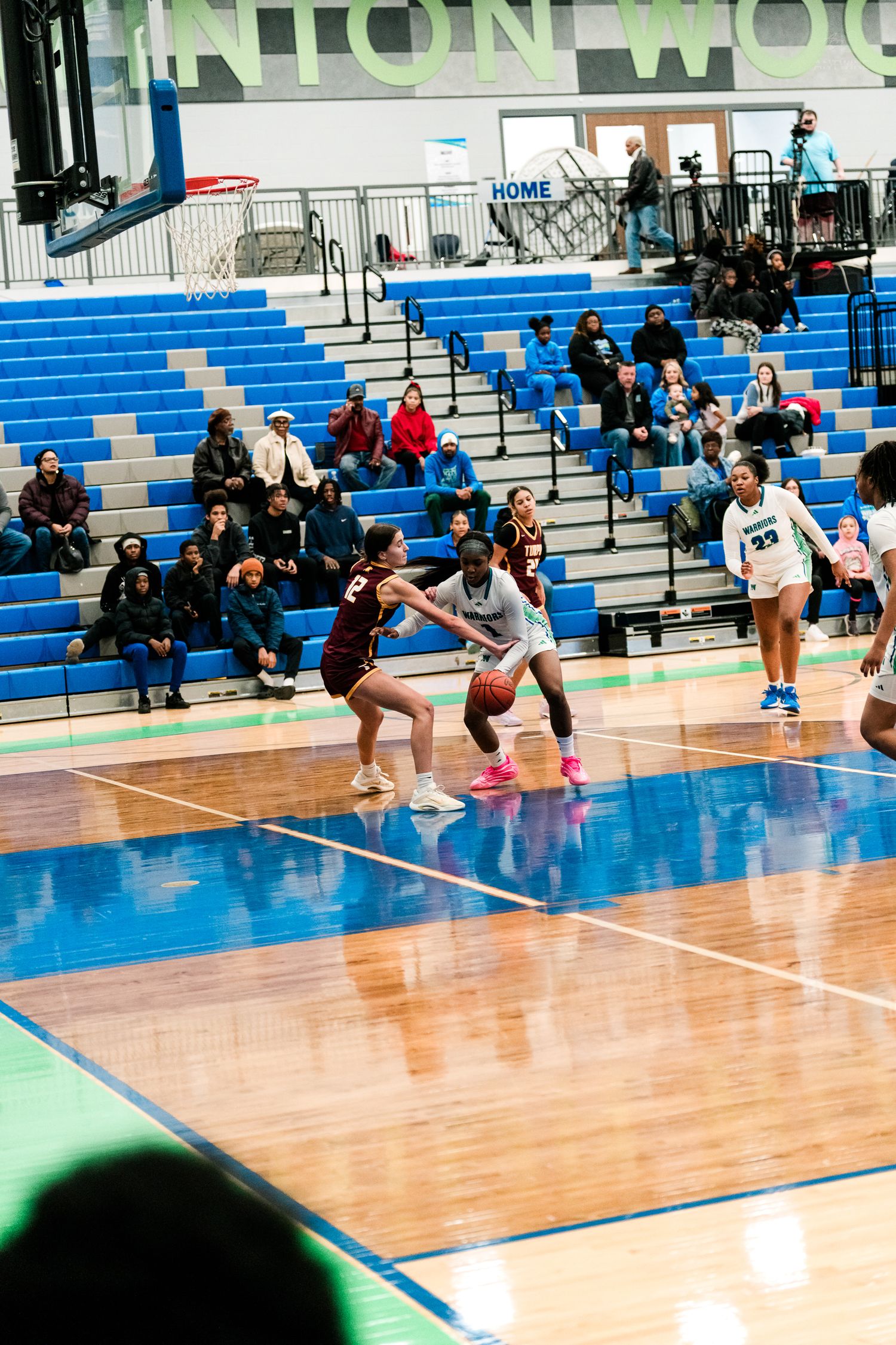Winton Woods girls basketball player dribbles past a Turpin defender during a home game.