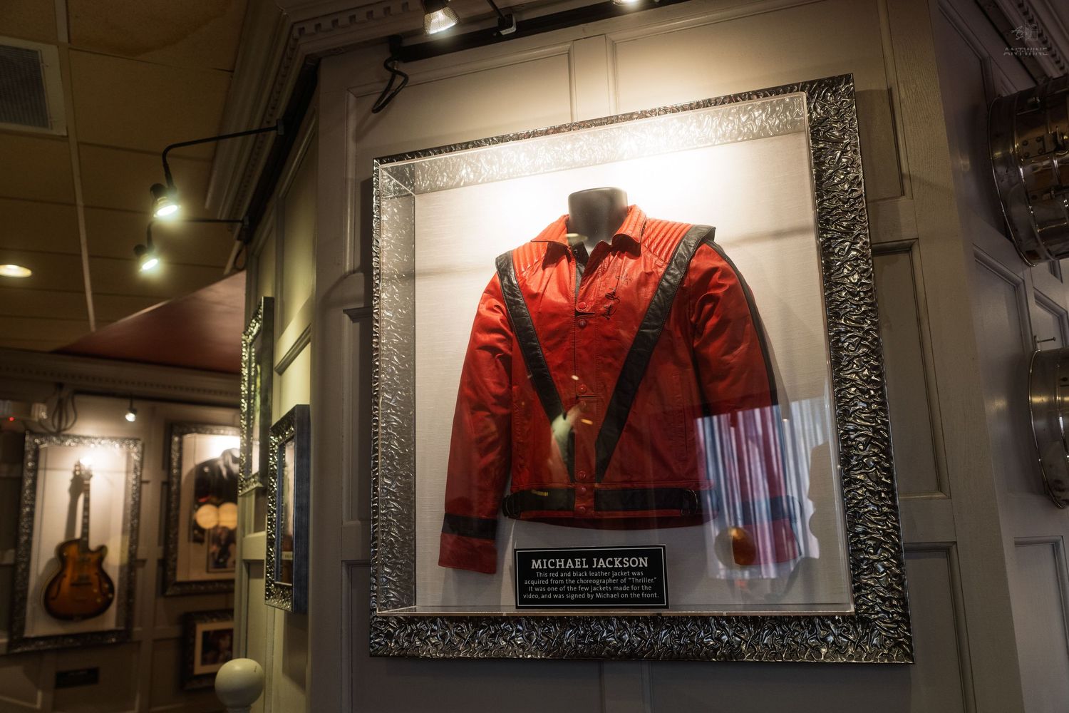 Michael Jacksons iconic red Thriller jacket displayed in a glass case at Hard Rock Cafe.