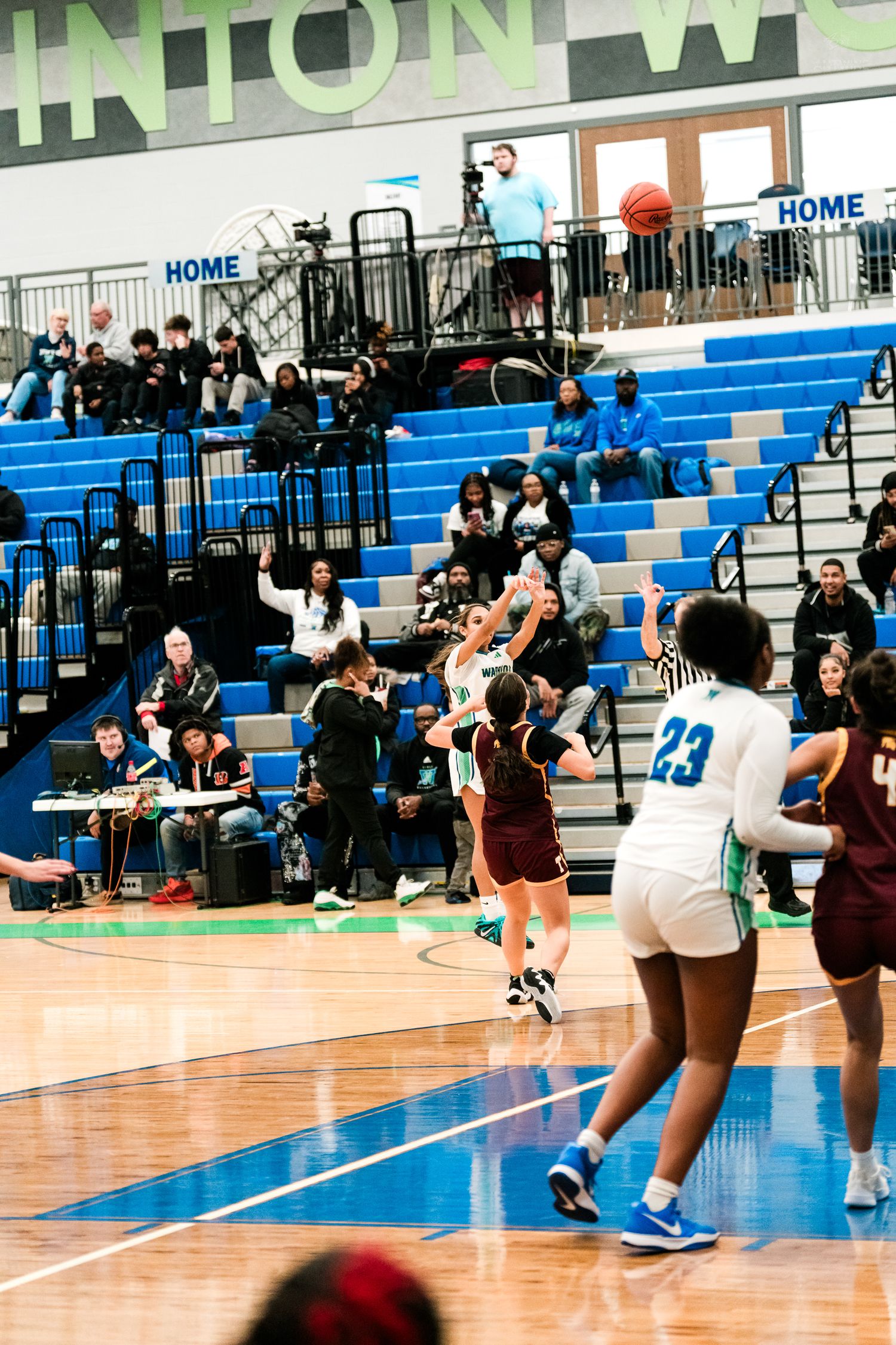 Warriors player attempts a shot during a girls high school basketball game at Clinton.