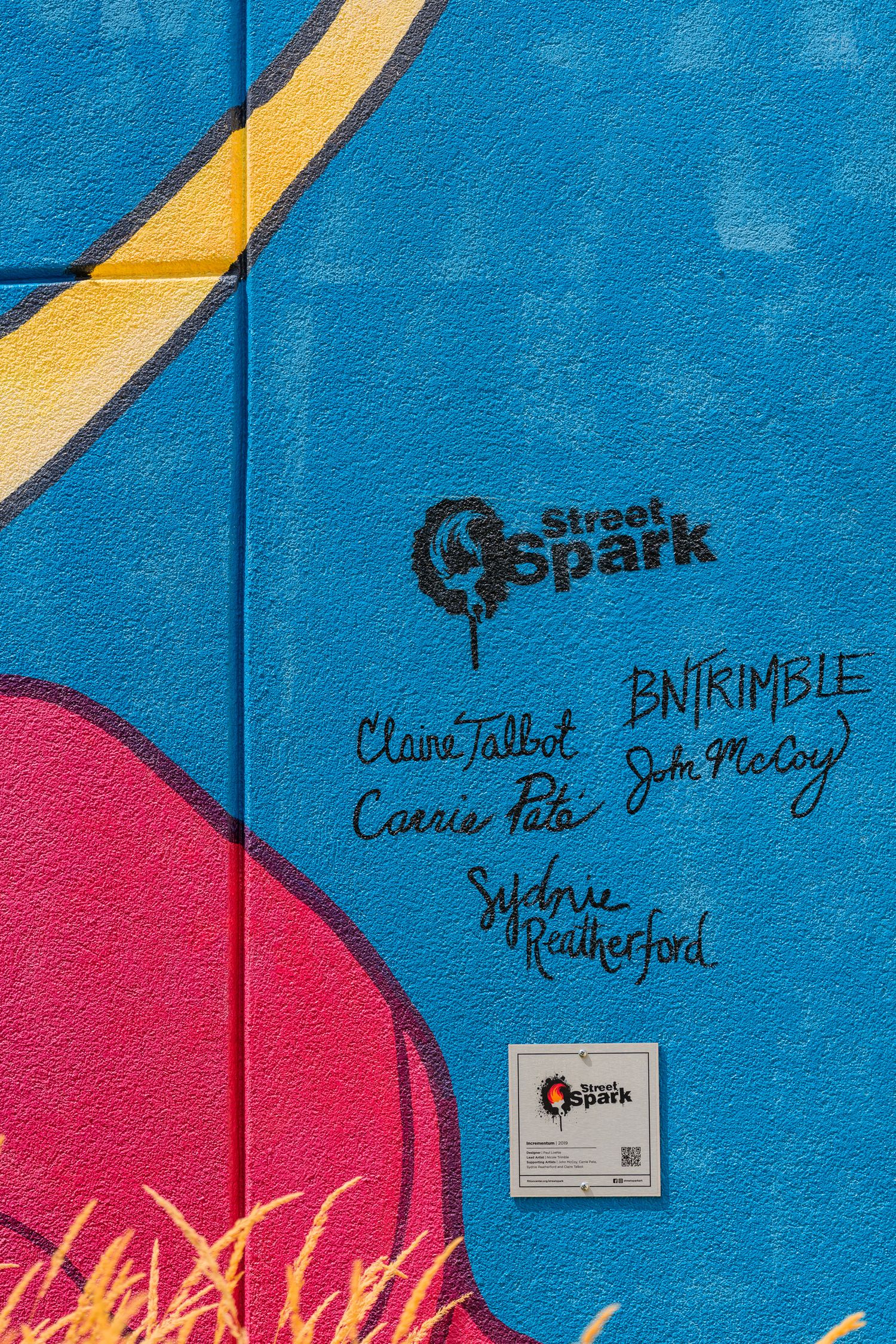Colorful Street Spark mural with signatures by Claire Talbot, Carrie Pato, BN Trimble, John McCoy, and Sydnee Rutherford.